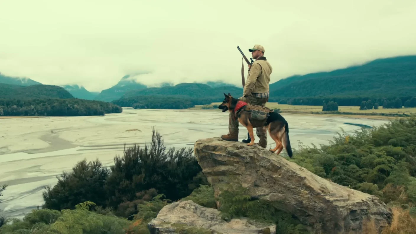 James Belmont and Odin stand above a wide mountain landscape in Heart of the Beast.
