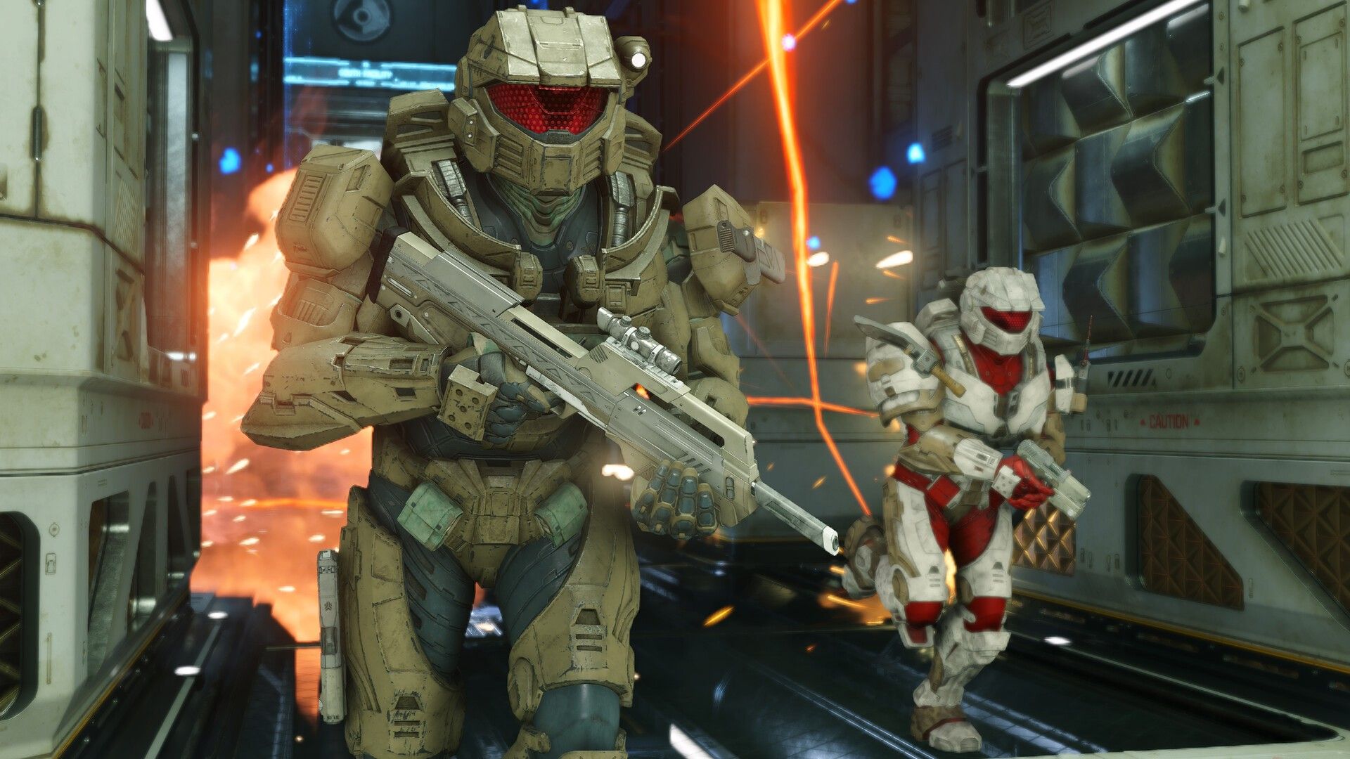 Master Chief advances with a rifle through a corridor under fire.