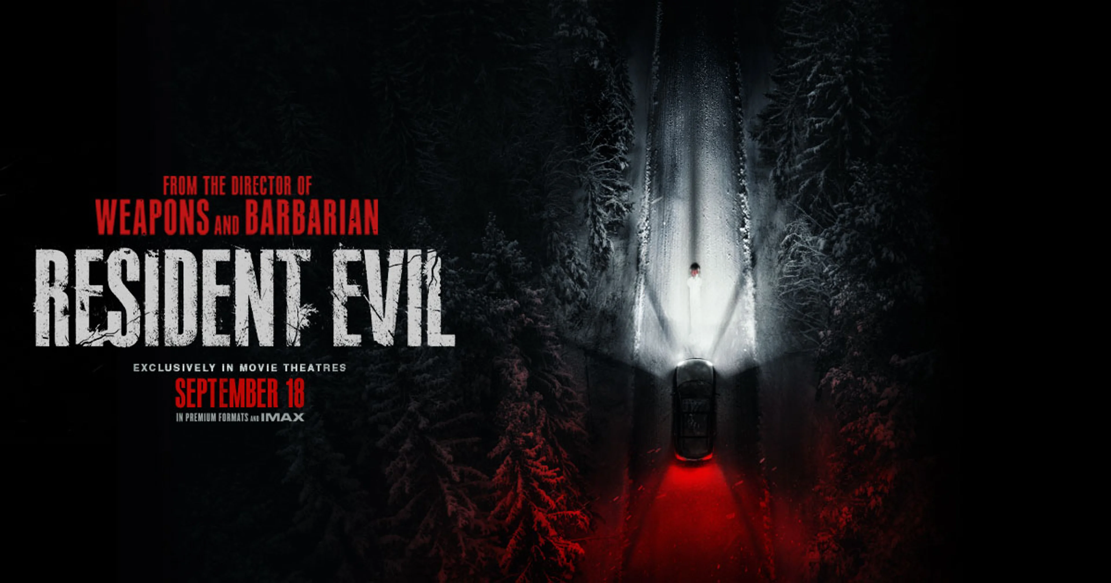 Official Resident Evil movie artwork showing a car stopped on a snowy forest road.