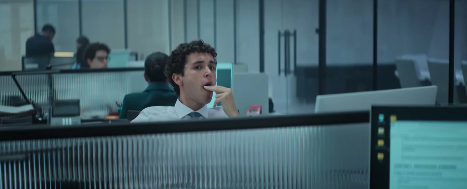 A young lawyer stands inside a modern office in WAR.
