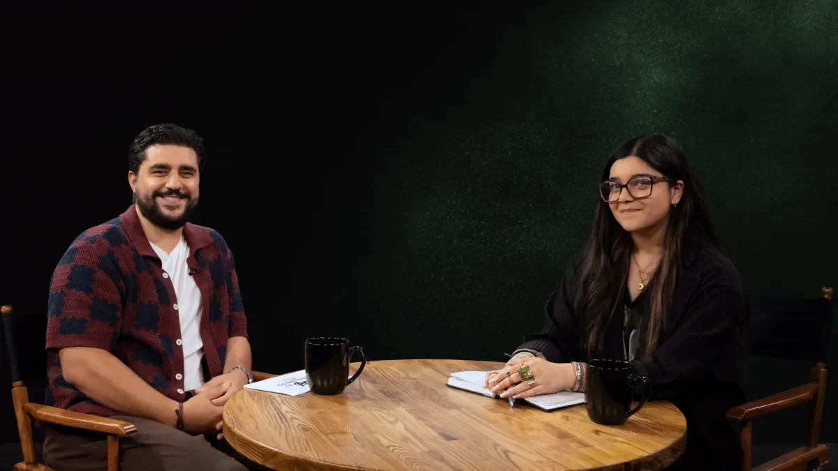 Iman Vellani and a podcast guest sit at a table in another official Countdown to Avengers: Doomsday image.