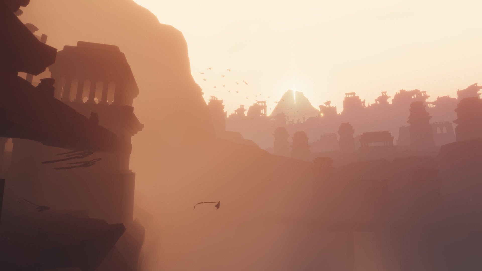 Sunlit ruins and the distant mountain appear across a hazy desert.
