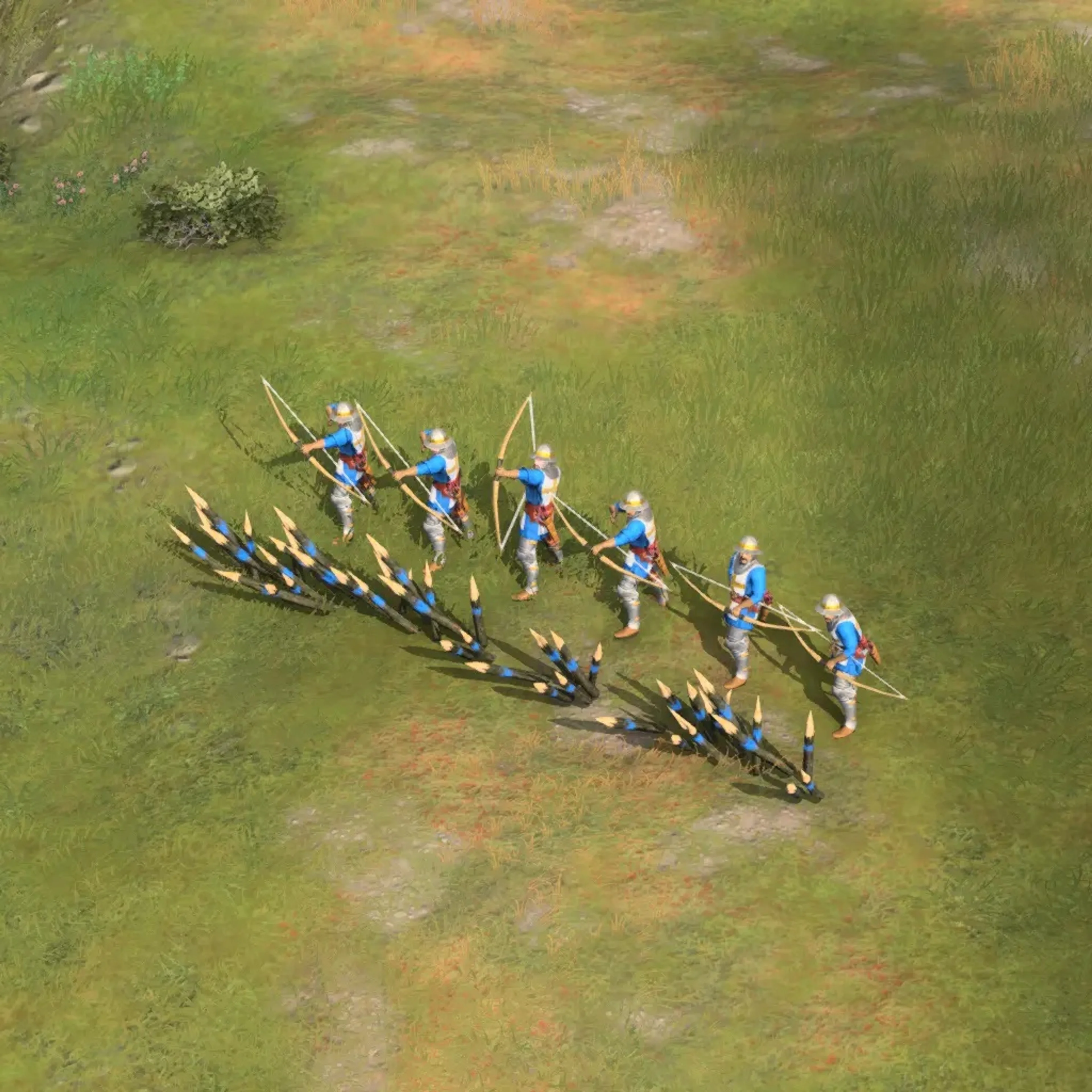English Longbowmen carry tall bows. Keep them behind a protective line and use their range; the blue clothing is the player color in this image, not a universal way to identify the unit.