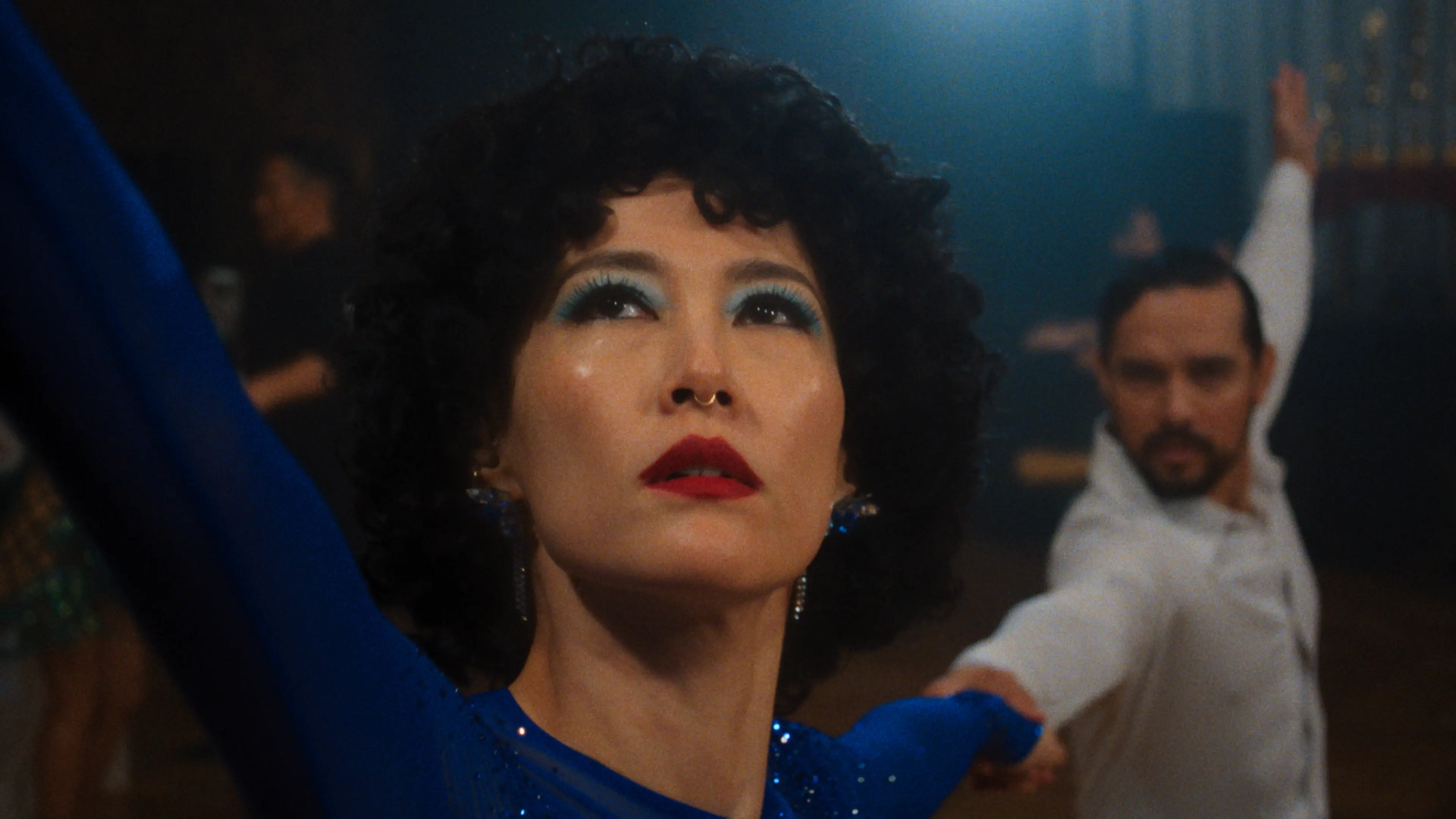 Rinko Kikuchi as Haru dancing in a blue dress in Ha-Chan, Shake Your Booty!