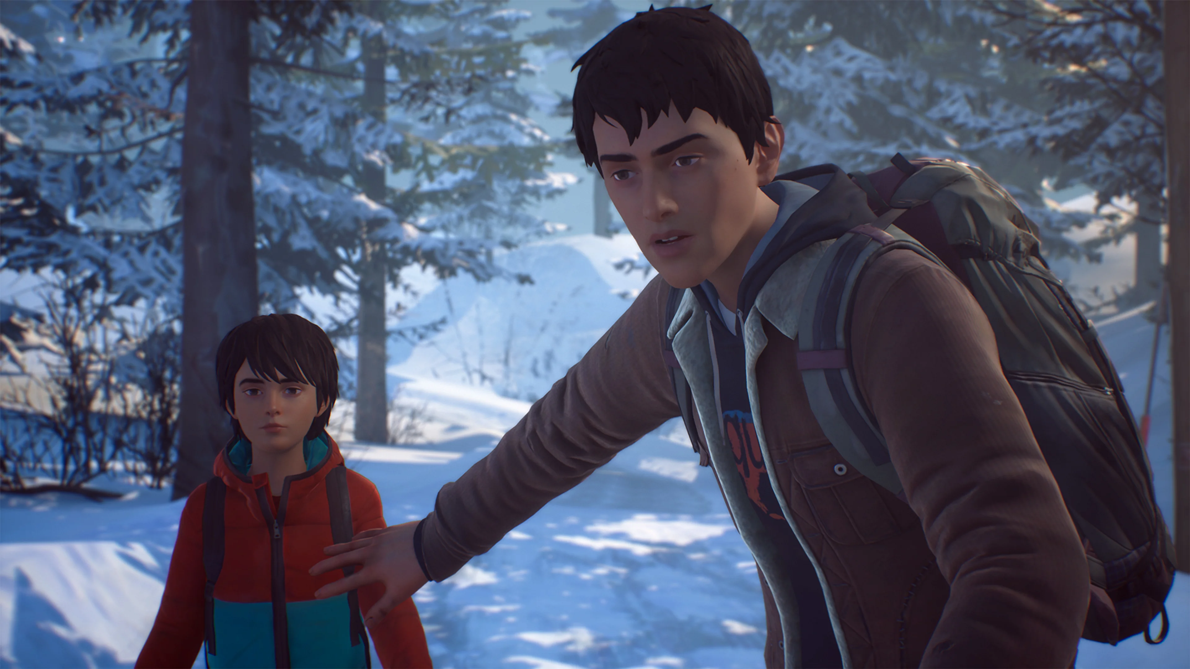 Sean stands in front of Daniel in a snowy forest in Life is Strange 2.