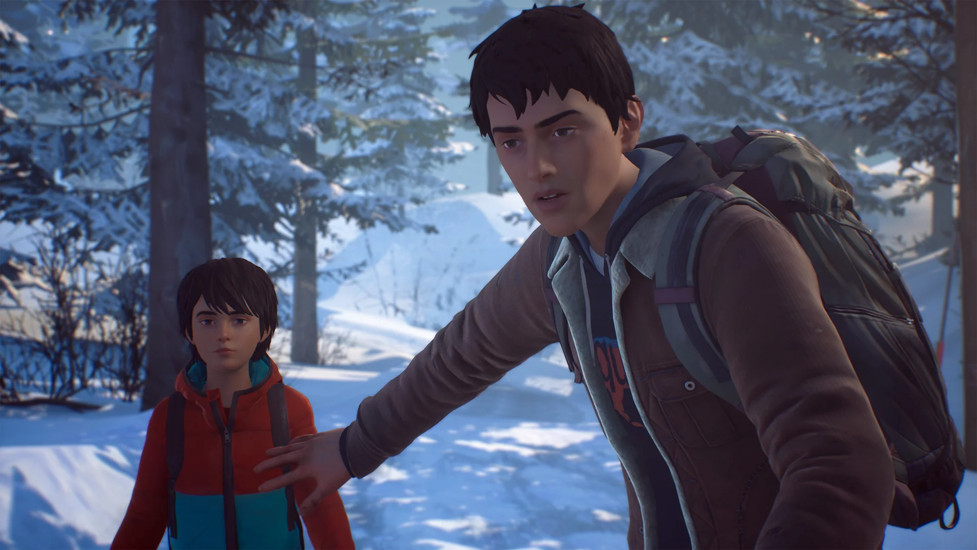 Sean stands in front of Daniel in a snowy forest in Life is Strange 2.