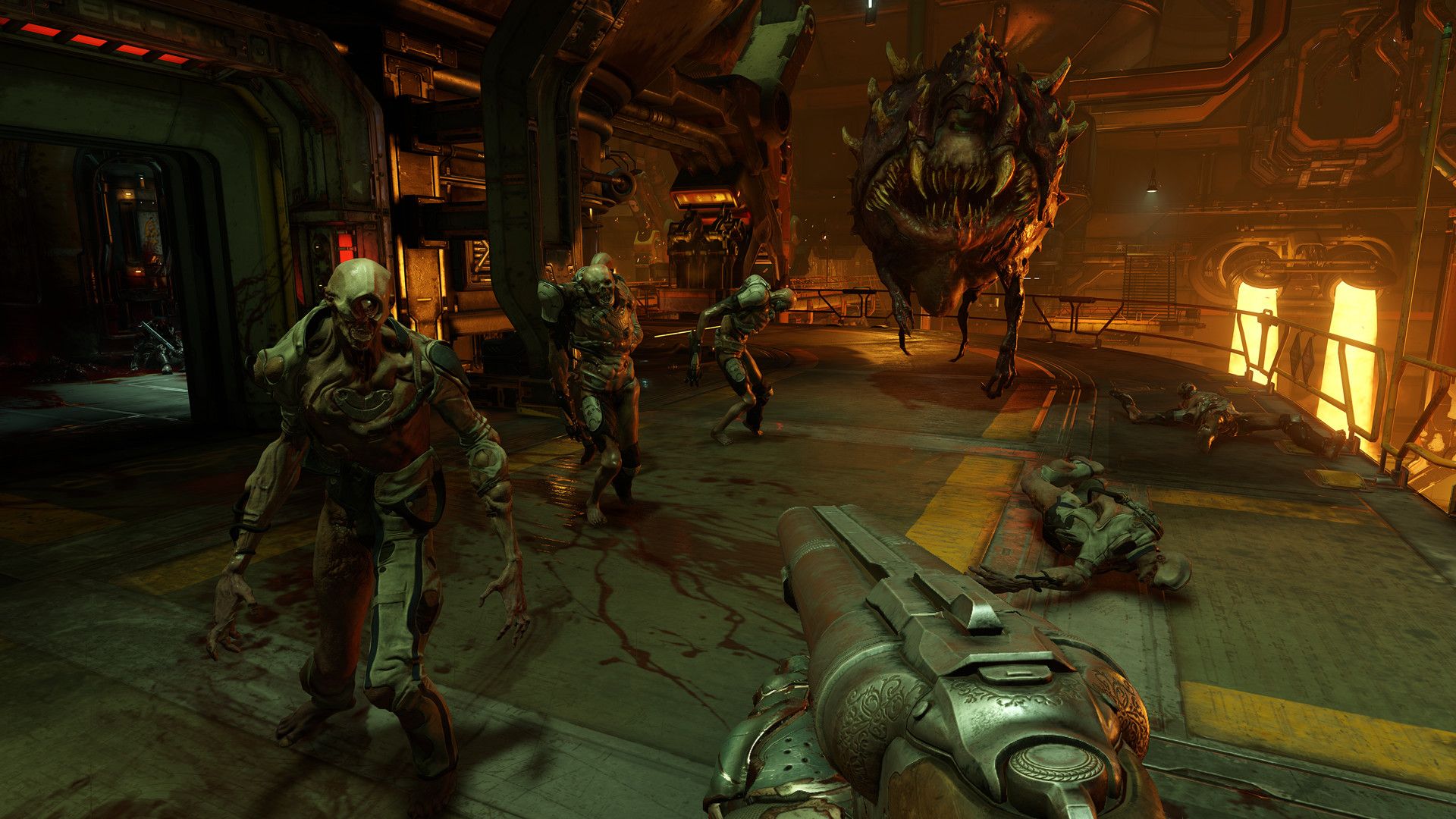 The Doom Slayer fights demons inside an industrial room.