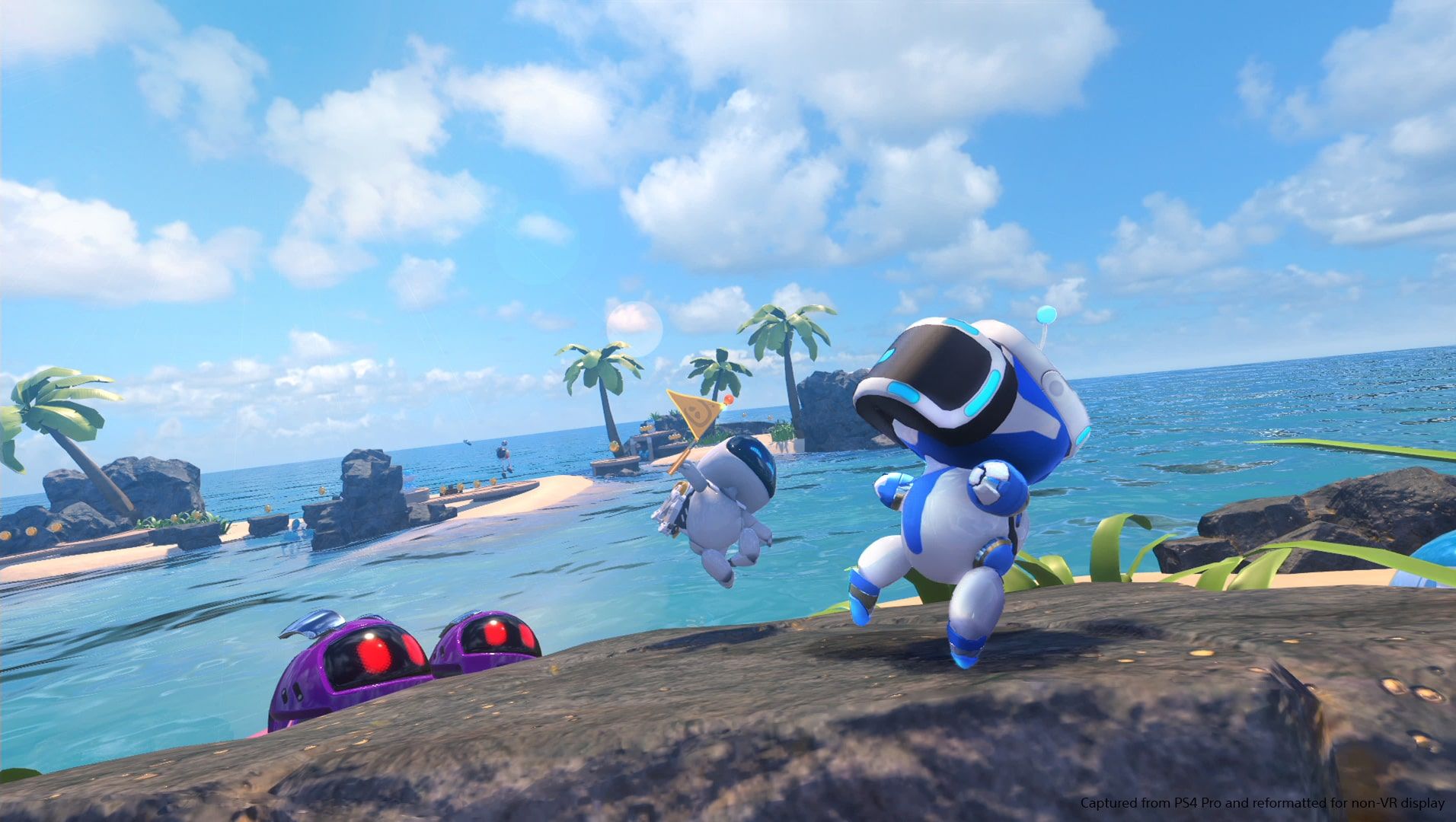 Astro travels across a sandy beach with obstacles and small enemies.