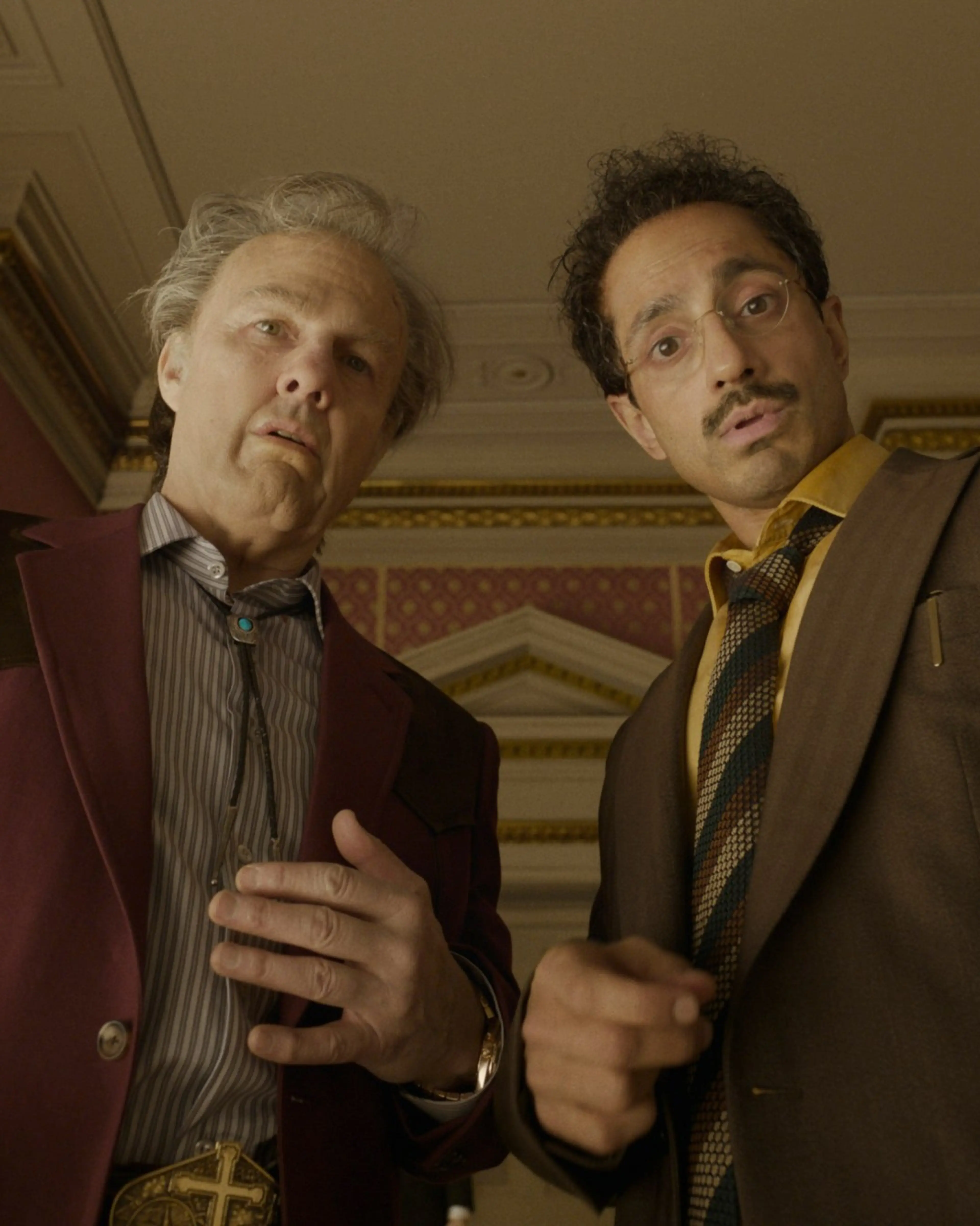 Tom Cruise as Digger Rockwell stands with Riz Ahmed in Digger.
