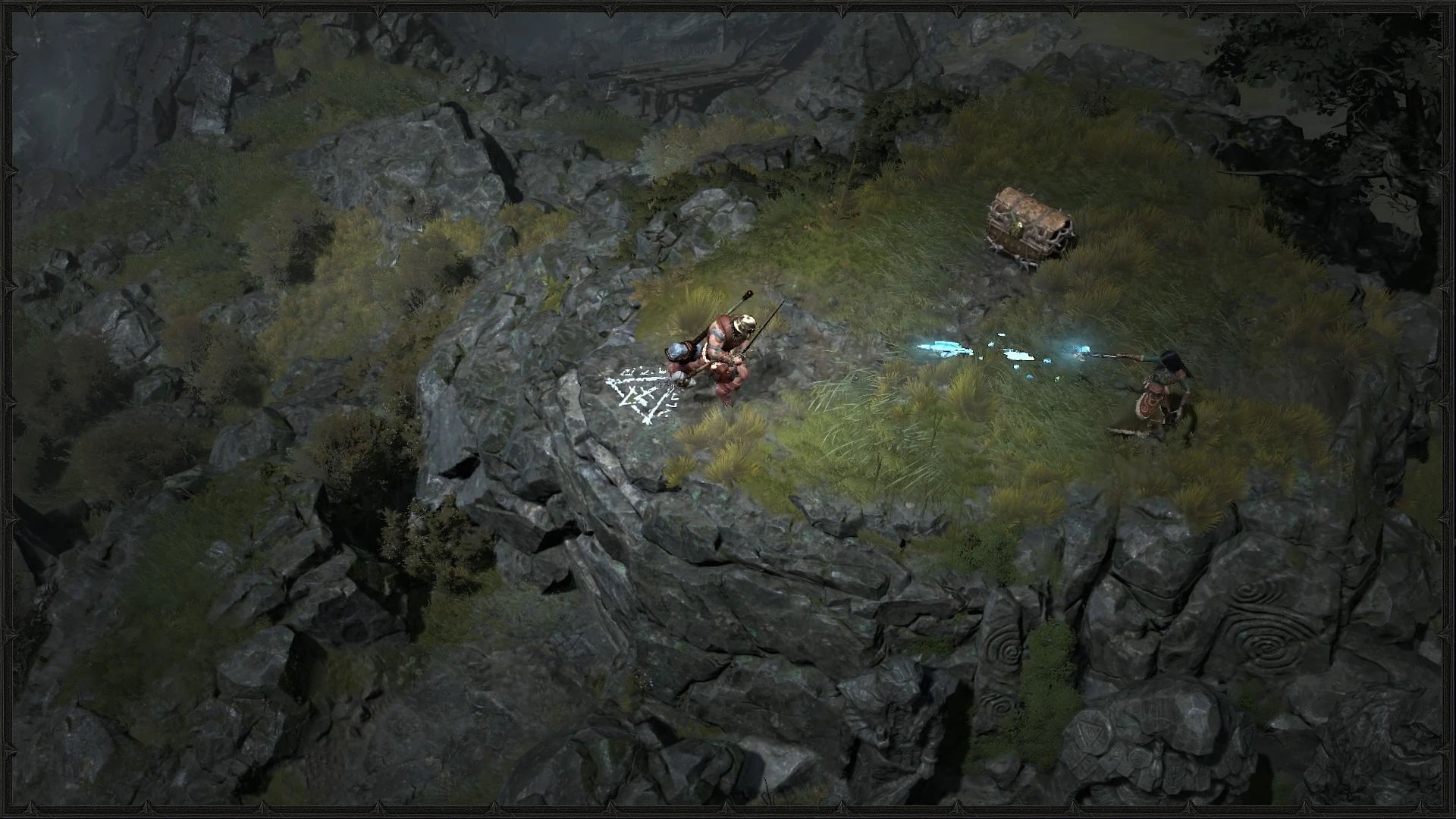 A Barbarian and a ranged spellcaster fight enemies together on a rocky Diablo IV path.