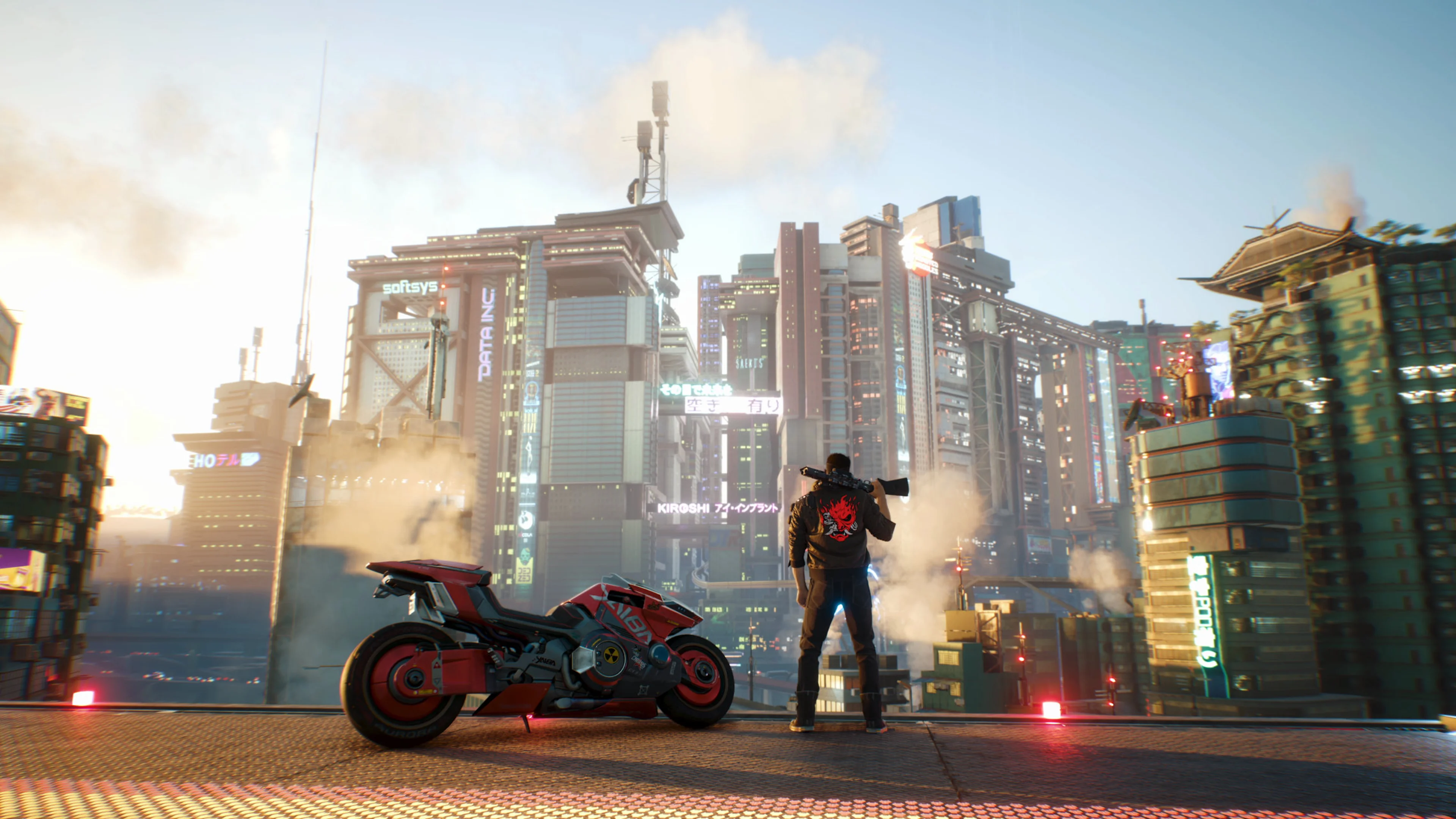 V looks out over Night City beside a motorcycle in an official Cyberpunk 2077 screenshot.