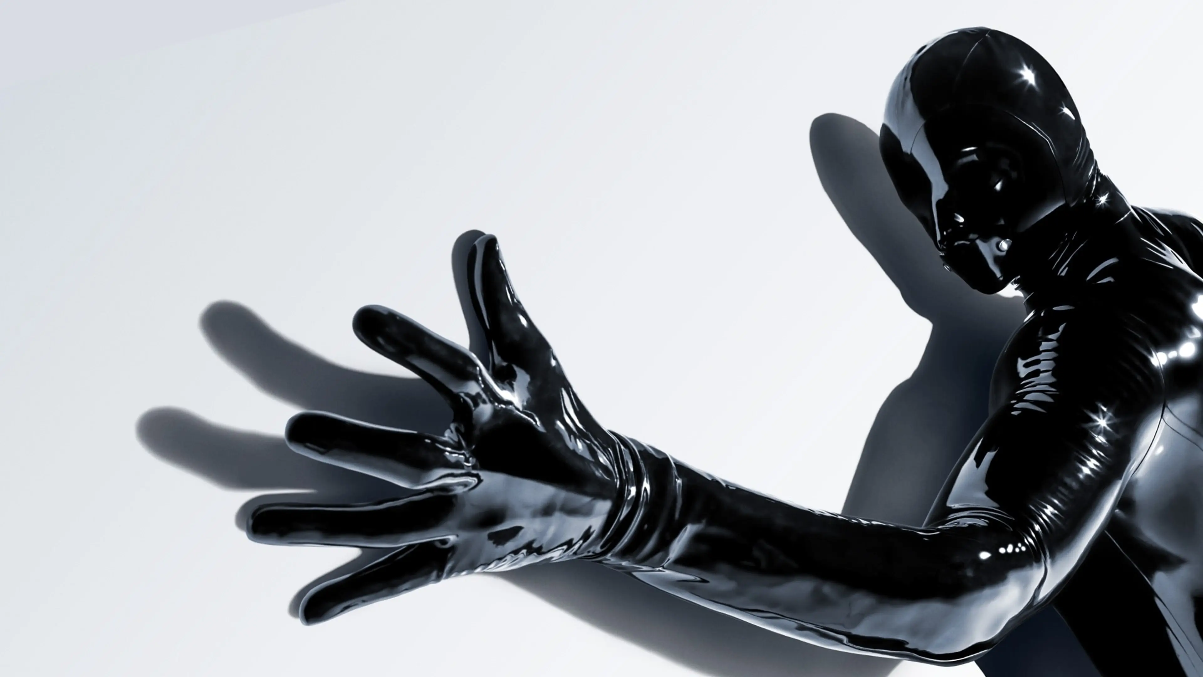 The Rubber Man reaches toward the camera in American Horror Story 13 key art.