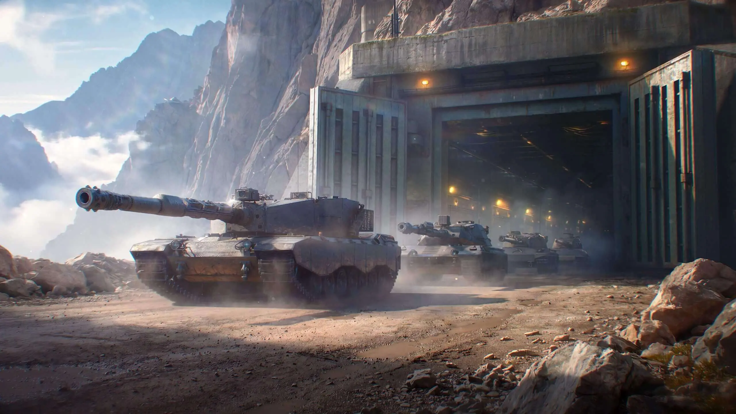 A column of German heavy tanks emerges from a mountain hangar in World of Tanks Update 2.4.