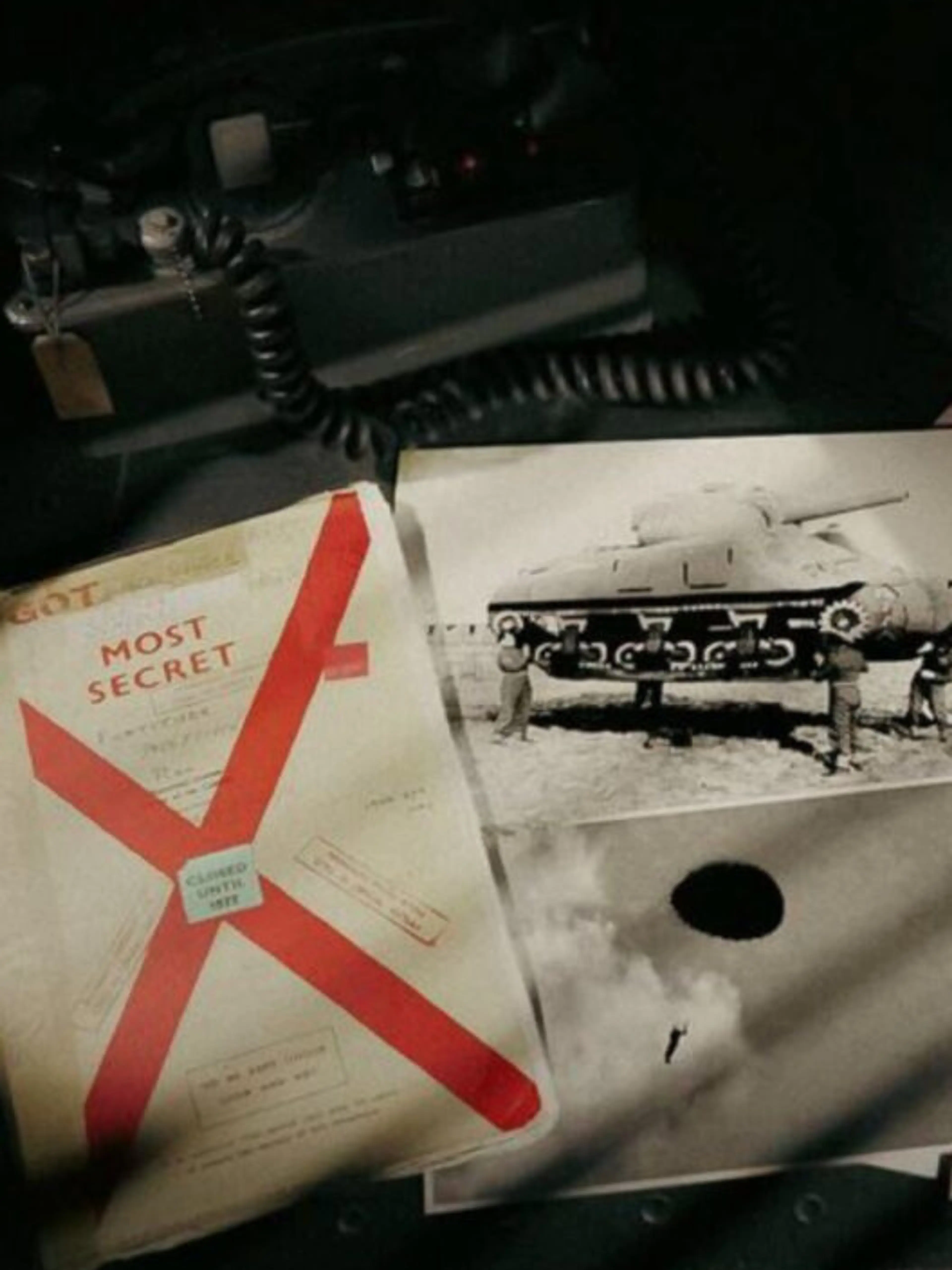 Operation Fortitude documents beside a photograph of an inflatable tank.