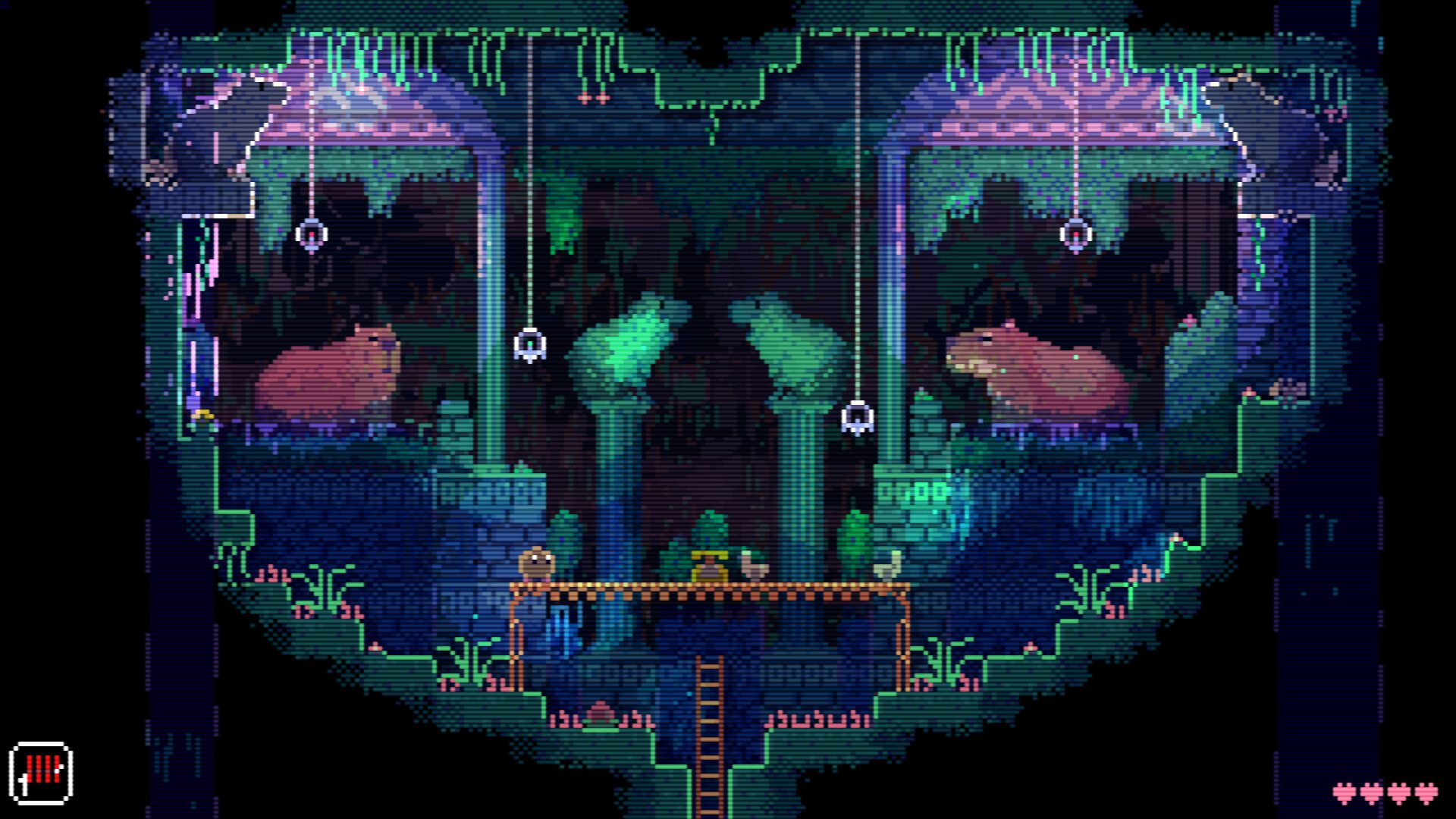 A compact symmetrical chamber has animal figures, hanging lights, an upper platform and a ladder below.