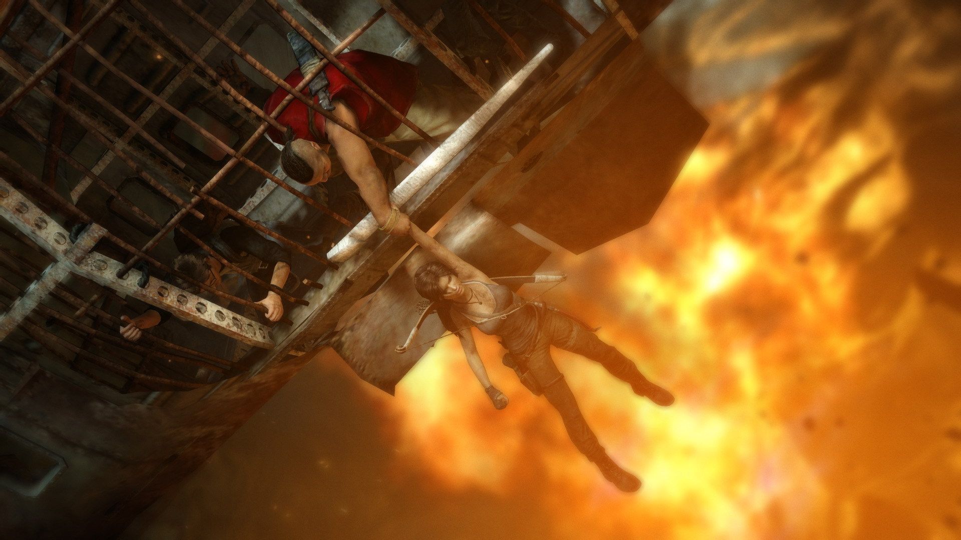Lara escapes as flames fill a tall industrial space.