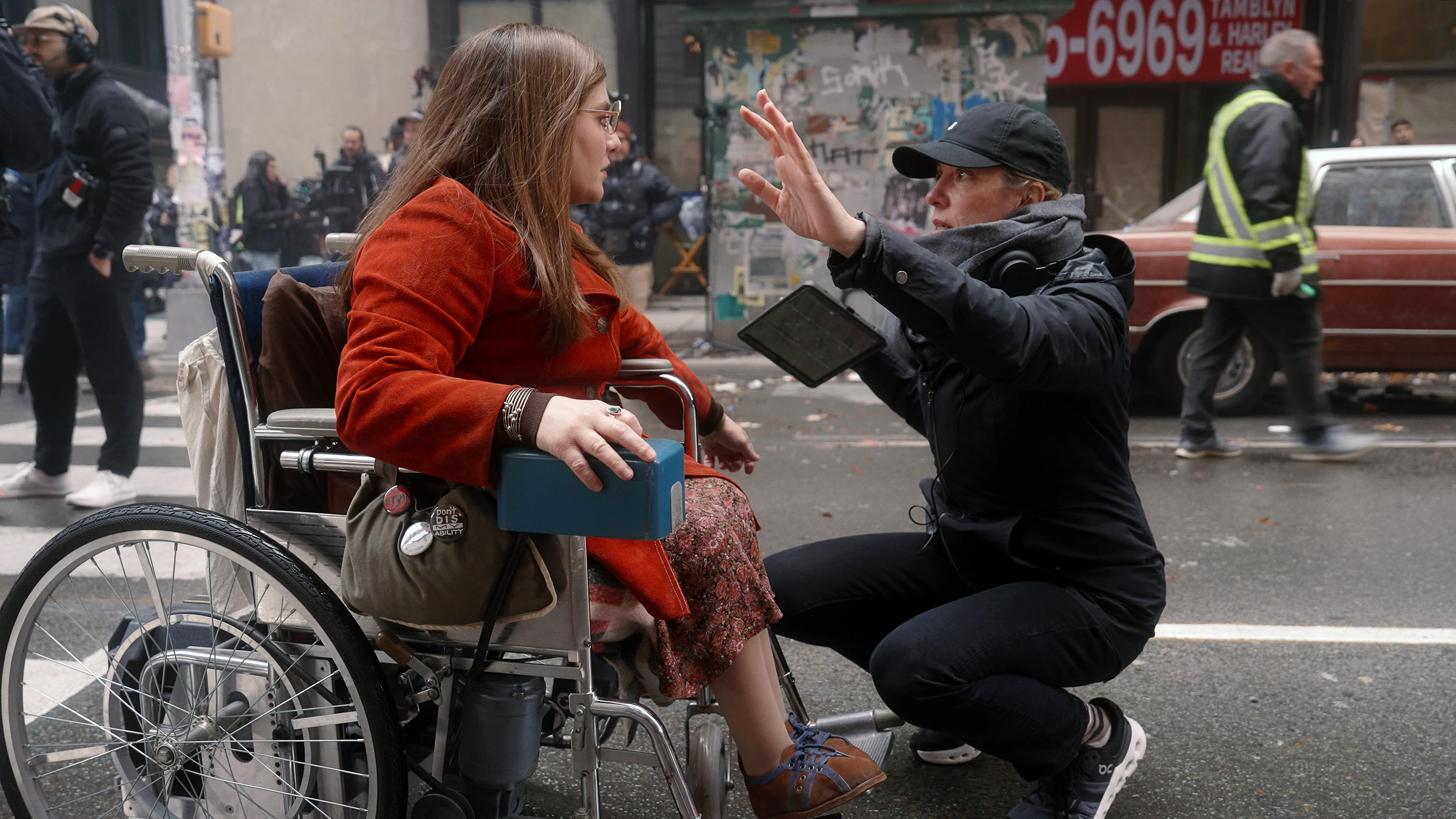 Director Siân Heder speaks with Ruth Madeley in costume as Judy Heumann on the Being Heumann set.
