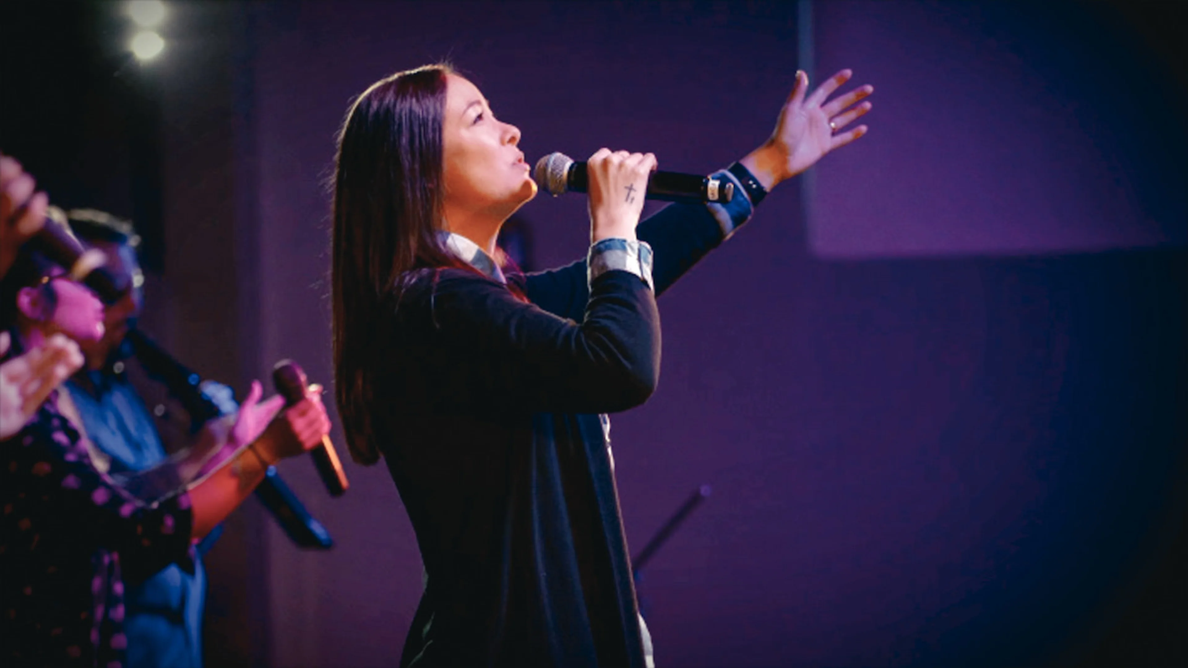 Mica Miller performs on stage in Death of the Pastor's Wife.