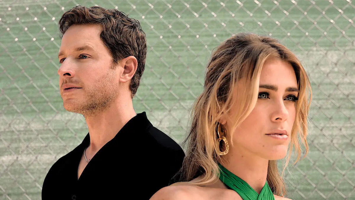 Josh Dallas and Melissa Roxburgh pose for Netflix while discussing the original Manifest series.