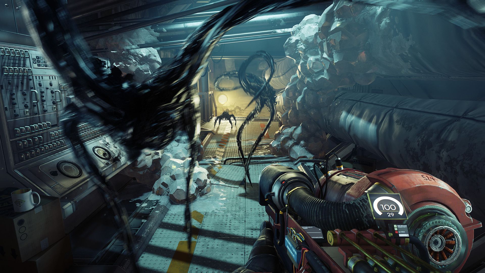 A Typhon creature reaches toward Morgan in a station room.