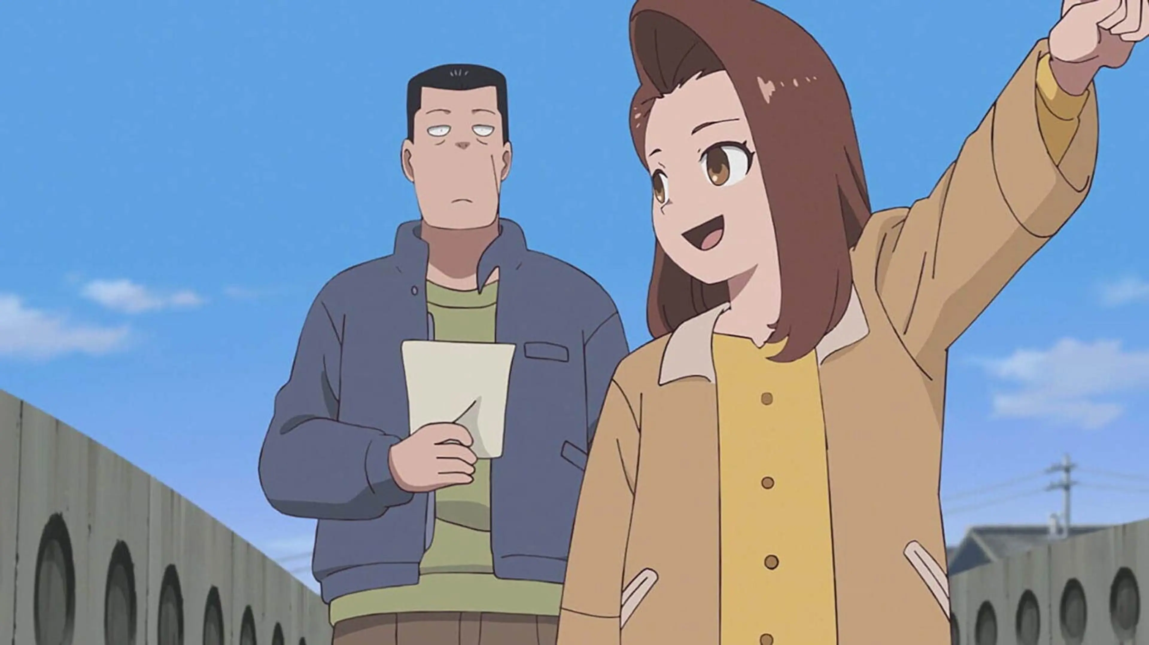 Nana points into the distance while Akutsu stands behind her holding a sheet of paper.