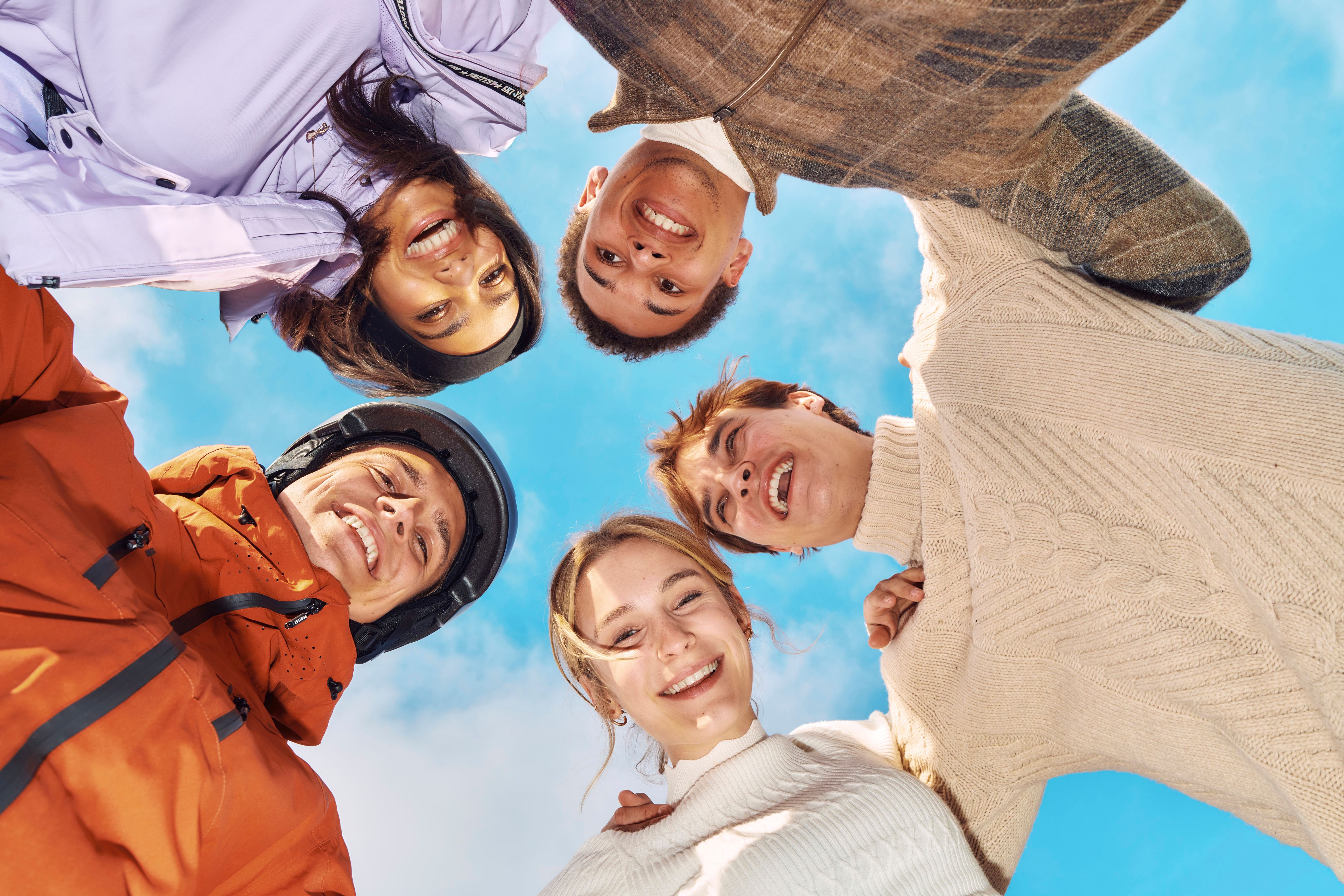 Five High Tides cast members lean together outdoors in an official Season 3 photo.