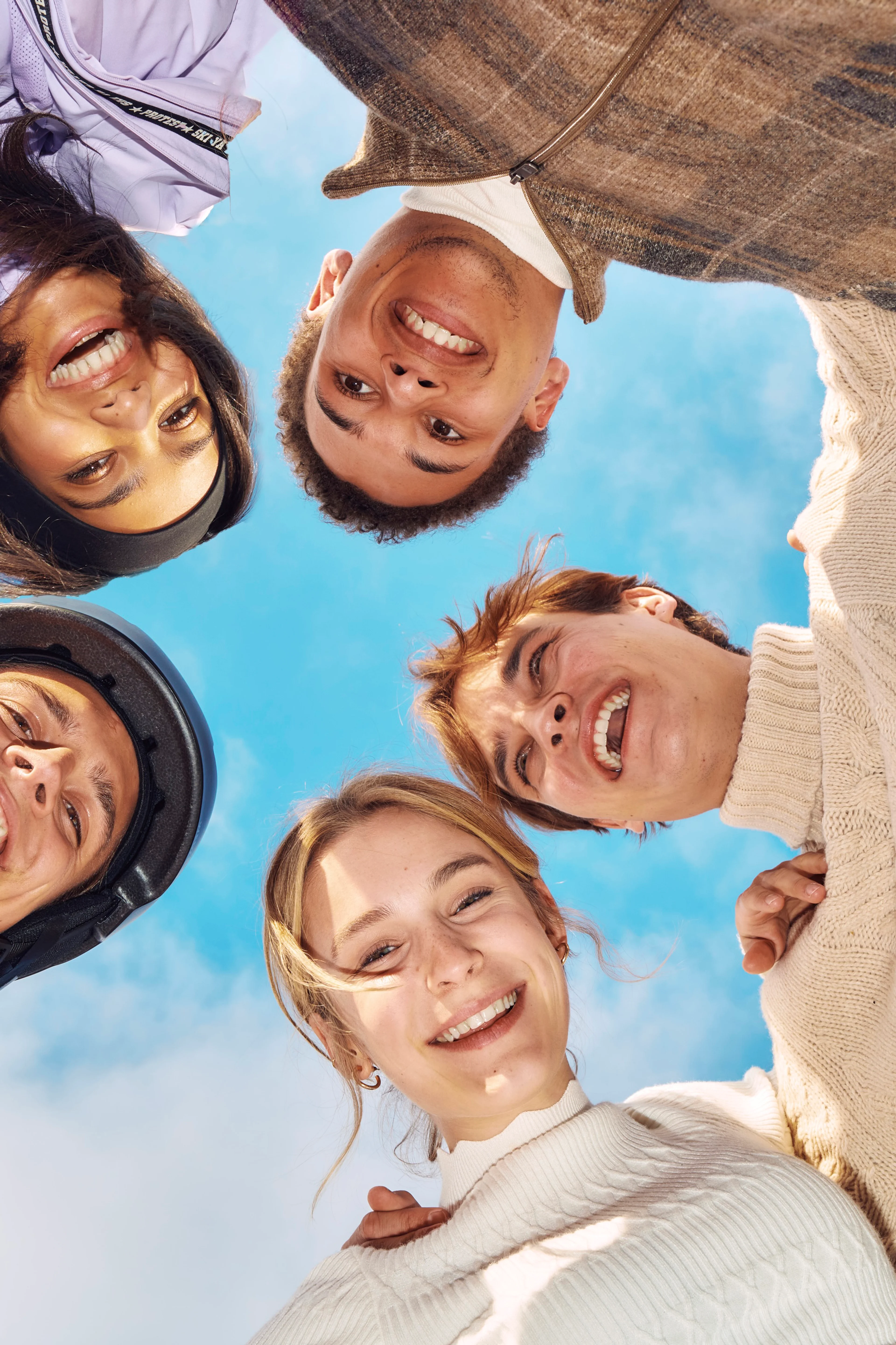 Five High Tides cast members lean together outdoors in an official Season 3 photo.