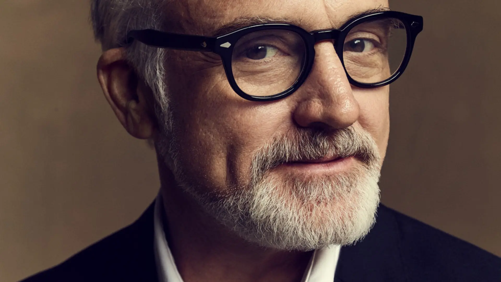 A close-up portrait of Bradley Whitford.