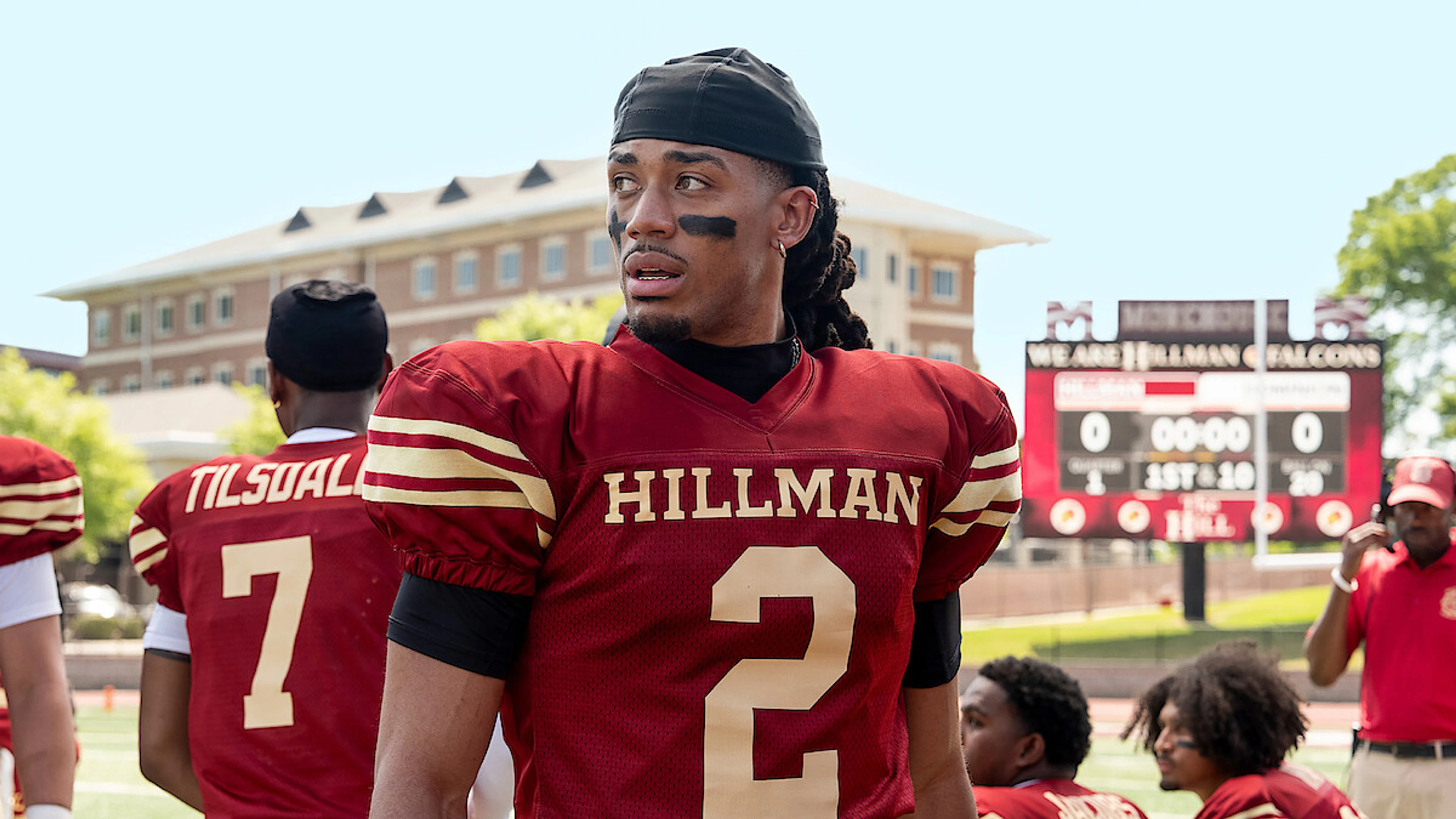Cornell Young IV as Shaquille on a football field.