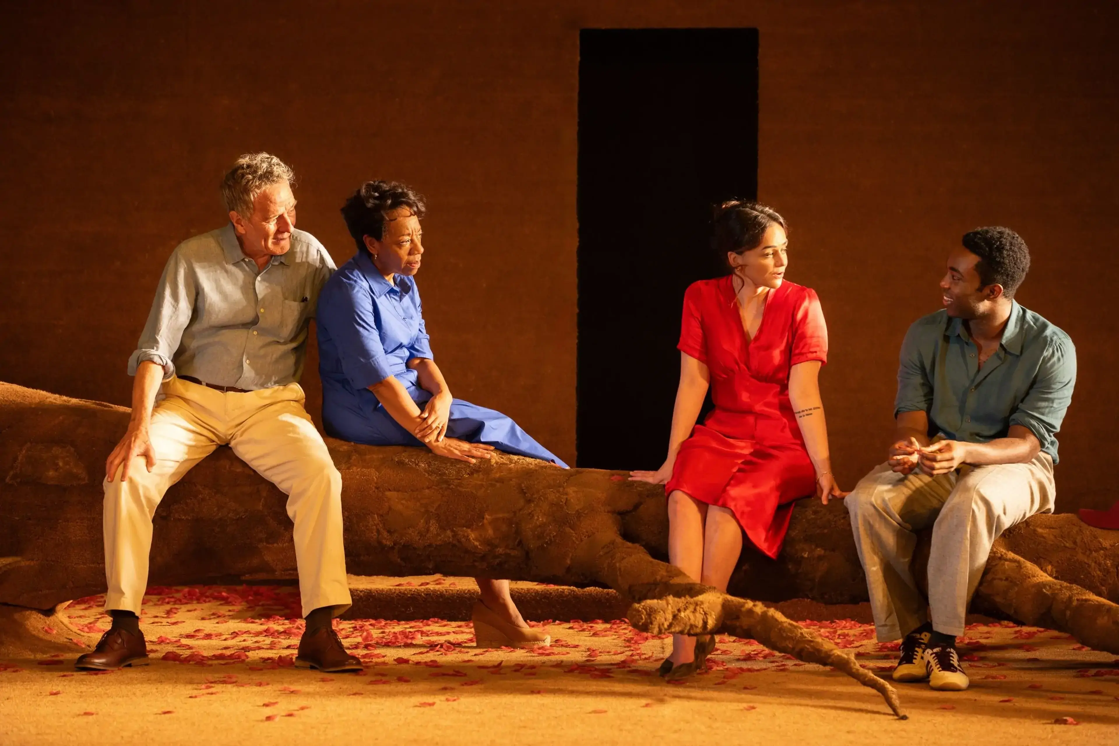 Bryan Cranston, Marianne Jean-Baptiste, Hayley Squires and Paapa Essiedu sit together on the All My Sons stage.