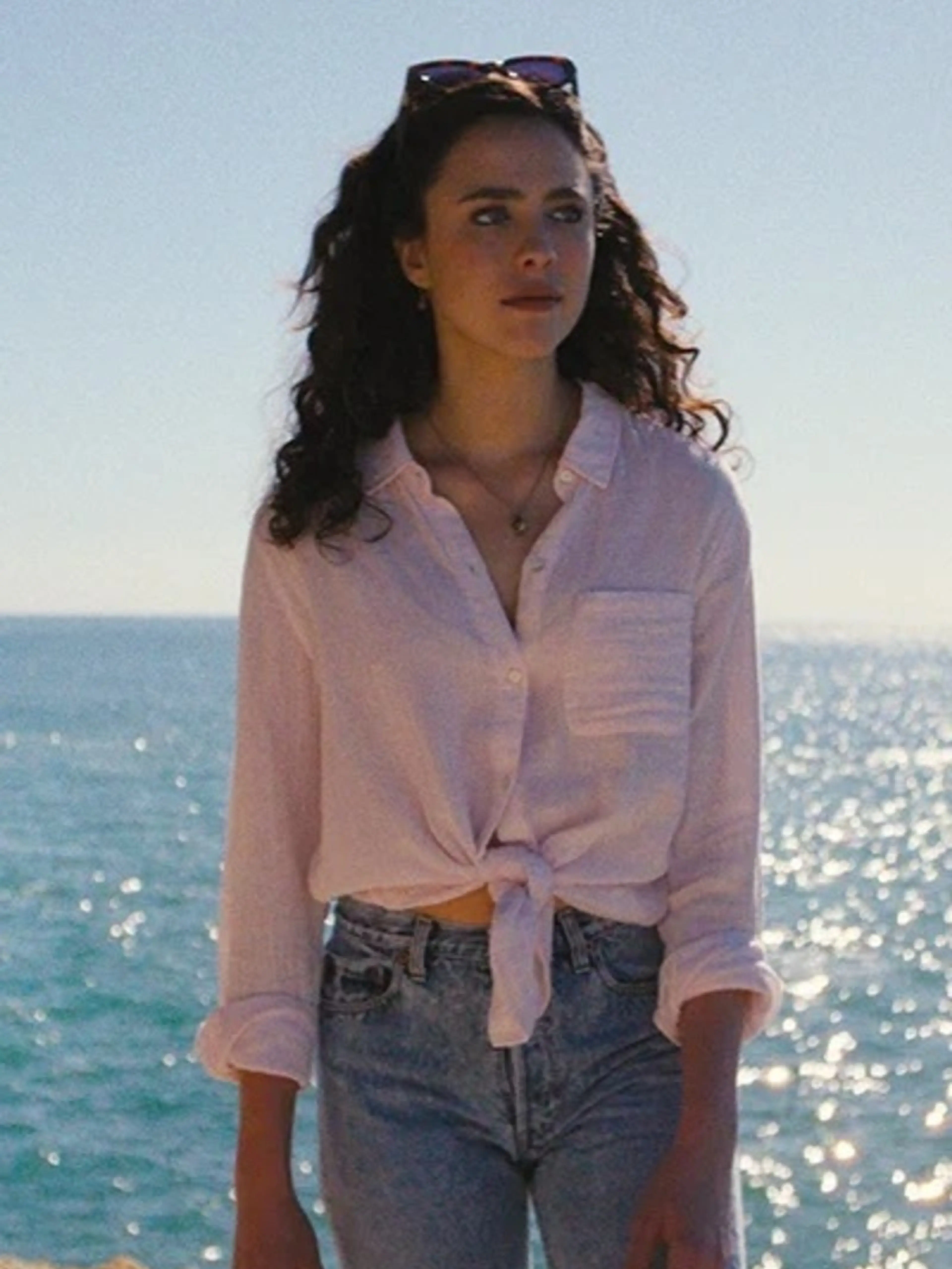 A woman stands beside the sea in an official still from Love of Your Life.