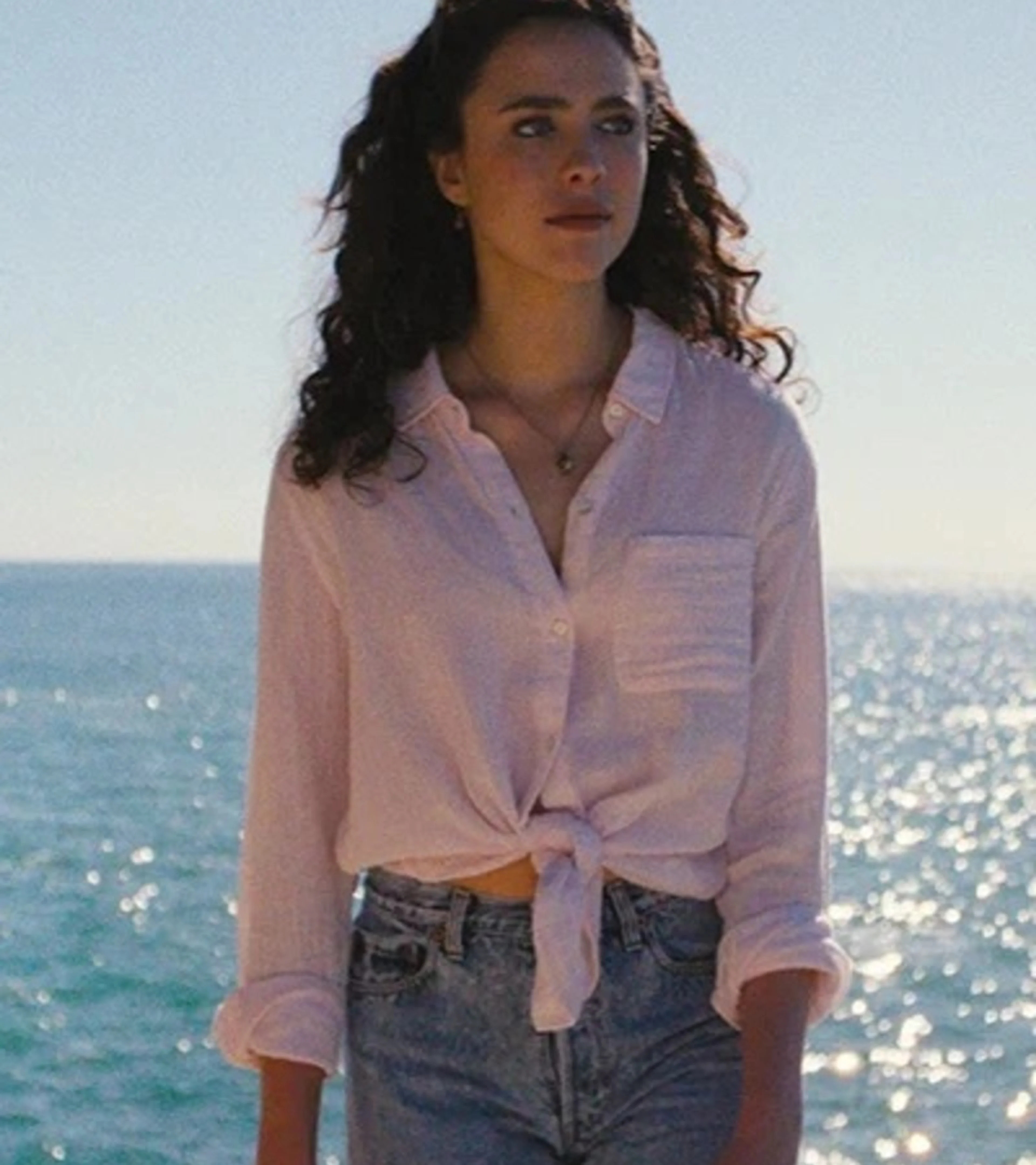 A woman stands beside the sea in an official still from Love of Your Life.
