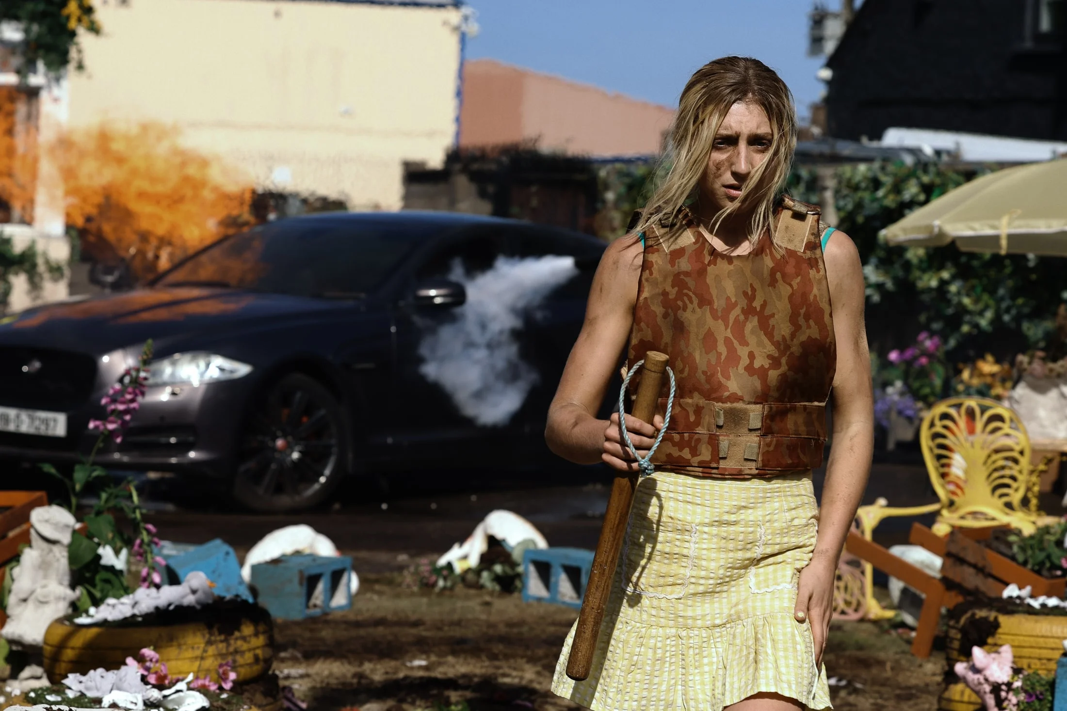 Ella-Lily Hyland stands outdoors in an official Tall Tales & Murder first-look photo.