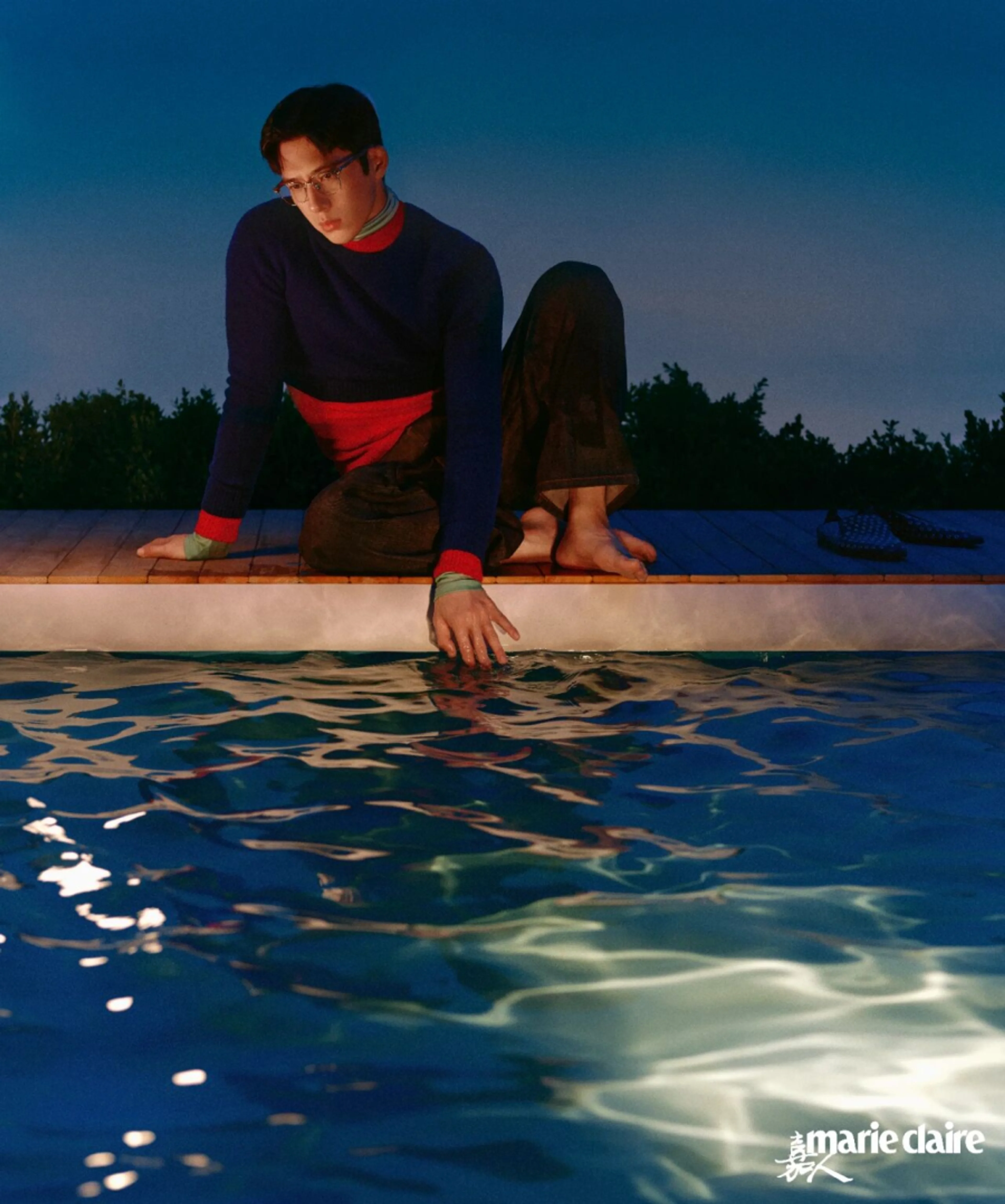 Jing Boran at the edge of a pool in the Marie Claire China photo story.