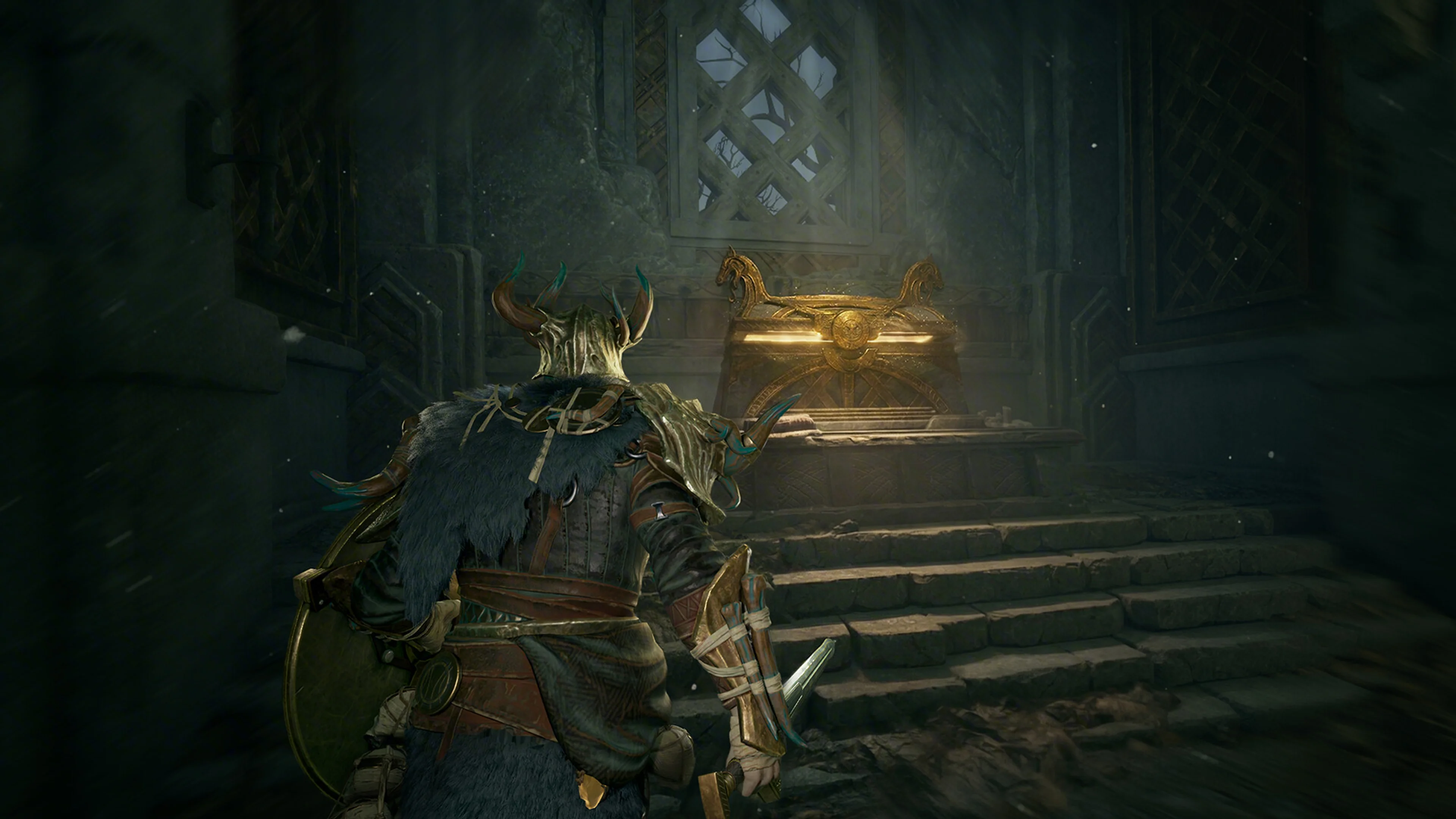 A Gyldhunter approaches a glowing treasure chest inside a dark stone room.