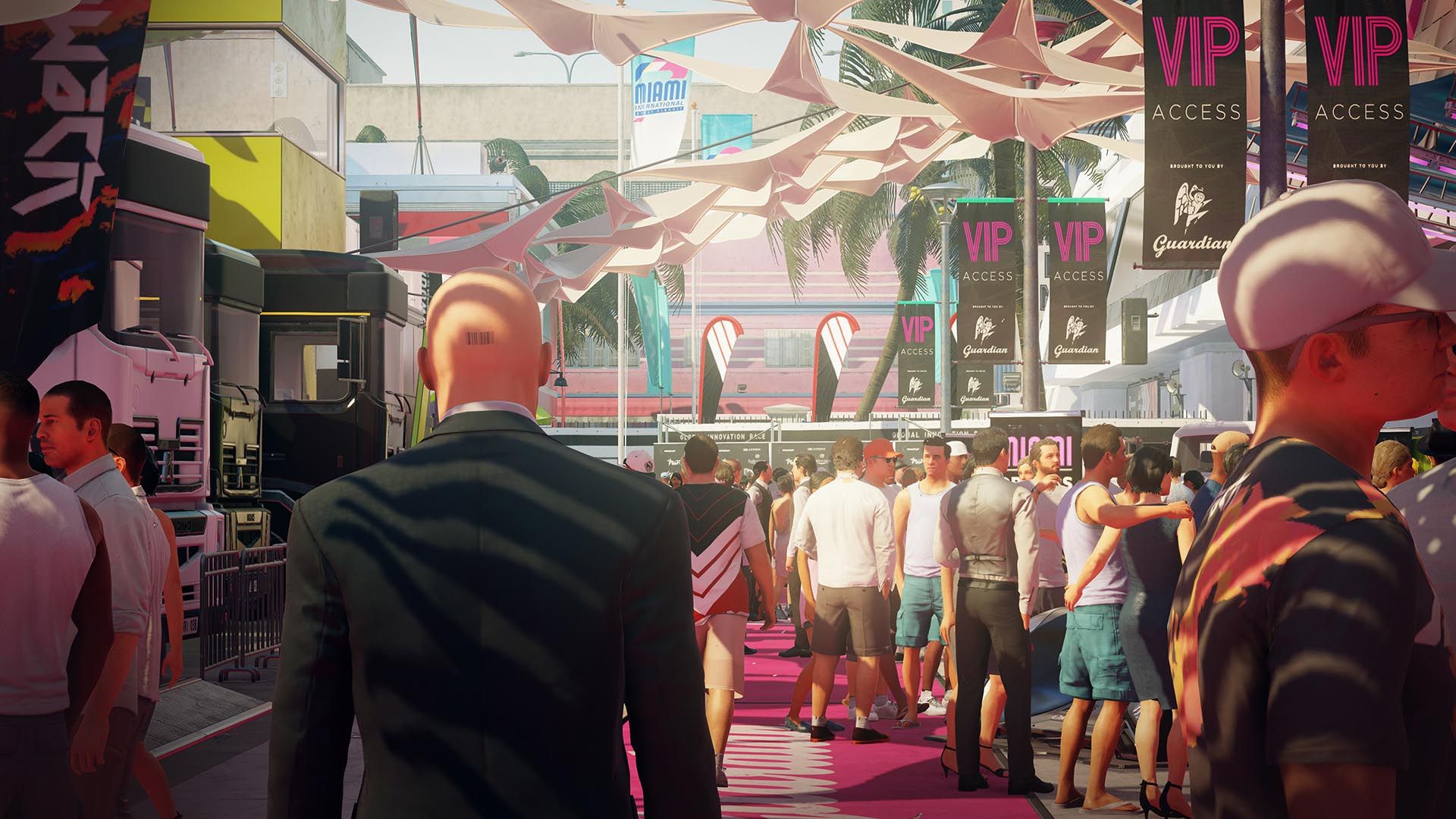 Agent 47 approaches a busy racing-event crowd and VIP entrance.