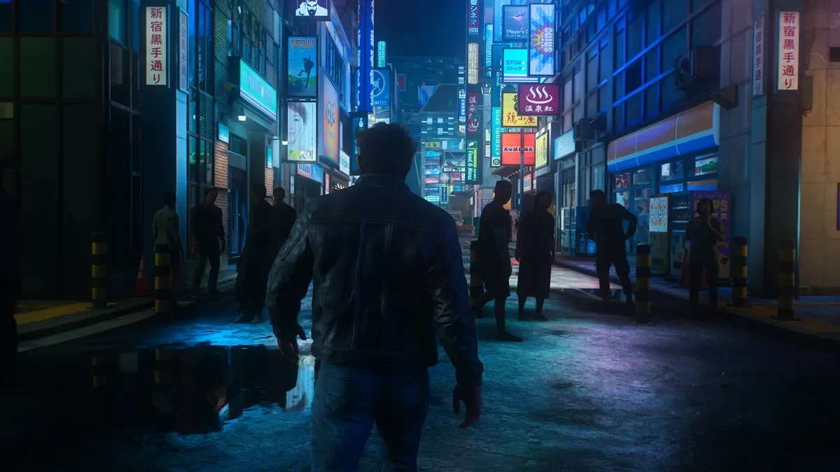 Logan walks through a crowded Japanese street lined with illuminated shop signs.