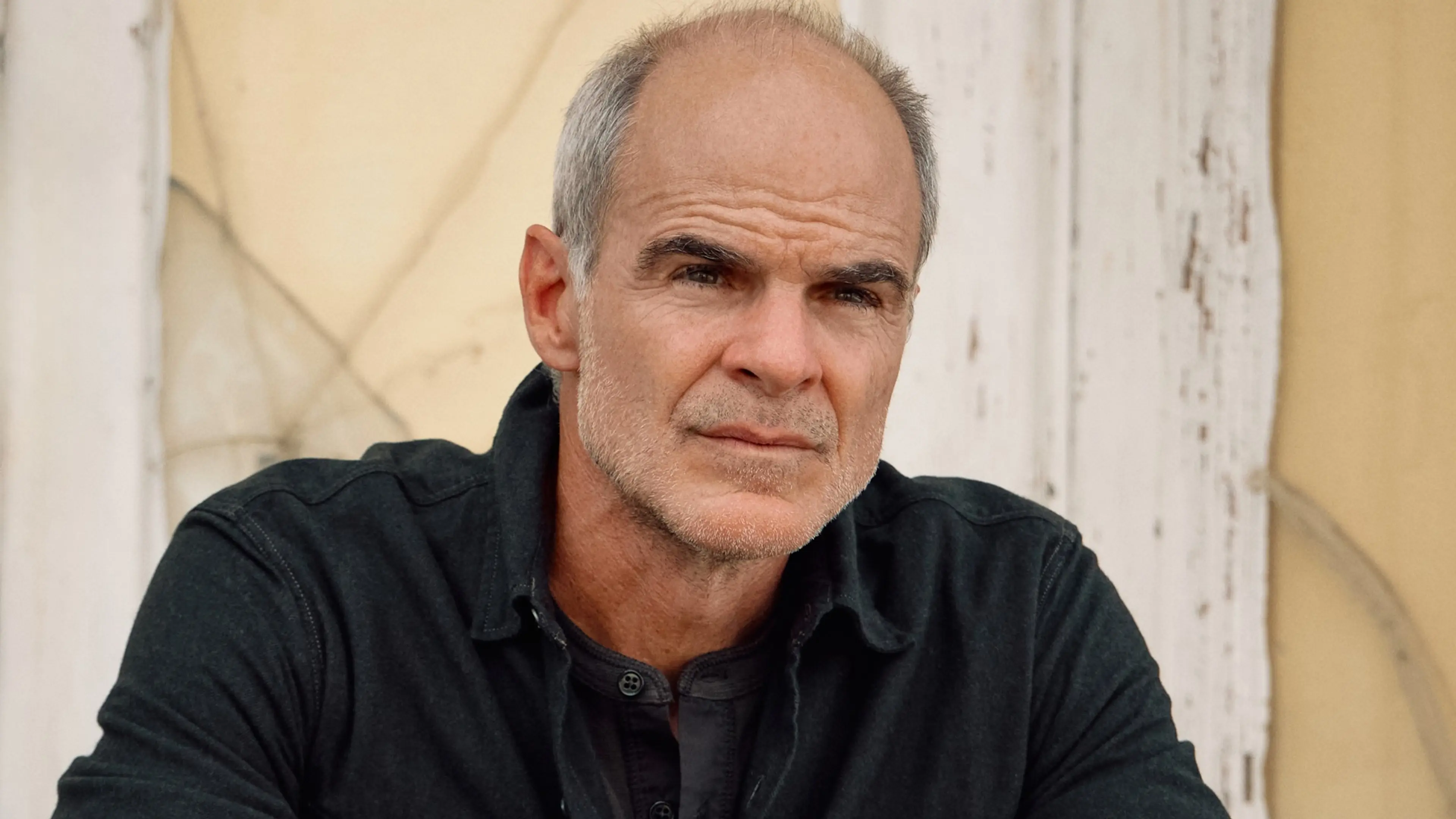 Michael Kelly looks toward the camera in an official portrait for his Landman Season 3 casting announcement.