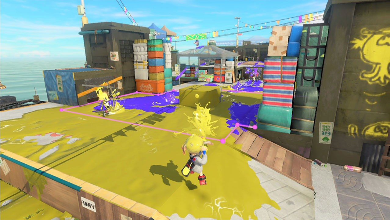 A player faces rival ink on a sunlit arena.