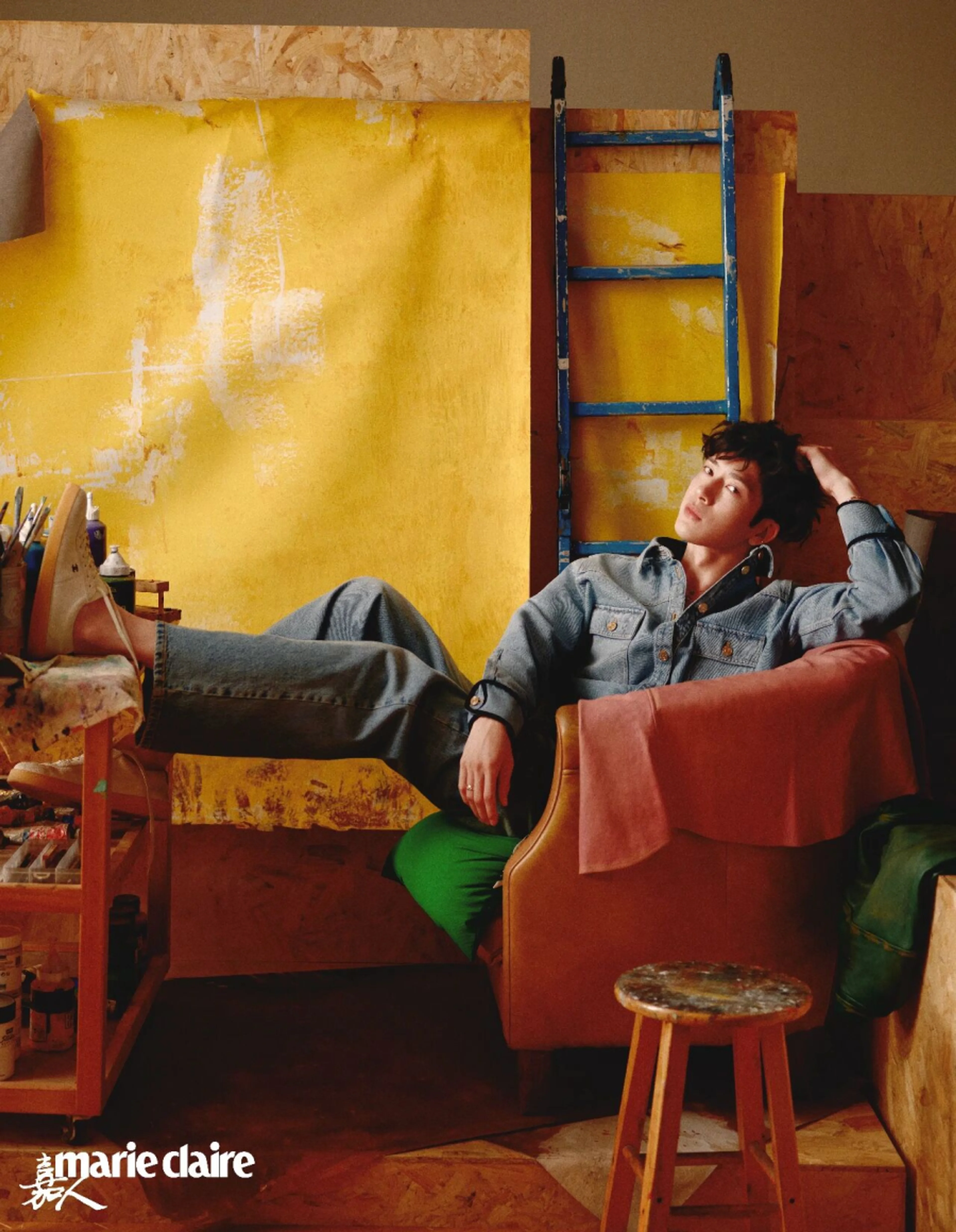 Jing Boran reclining in a studio setting for Marie Claire China.