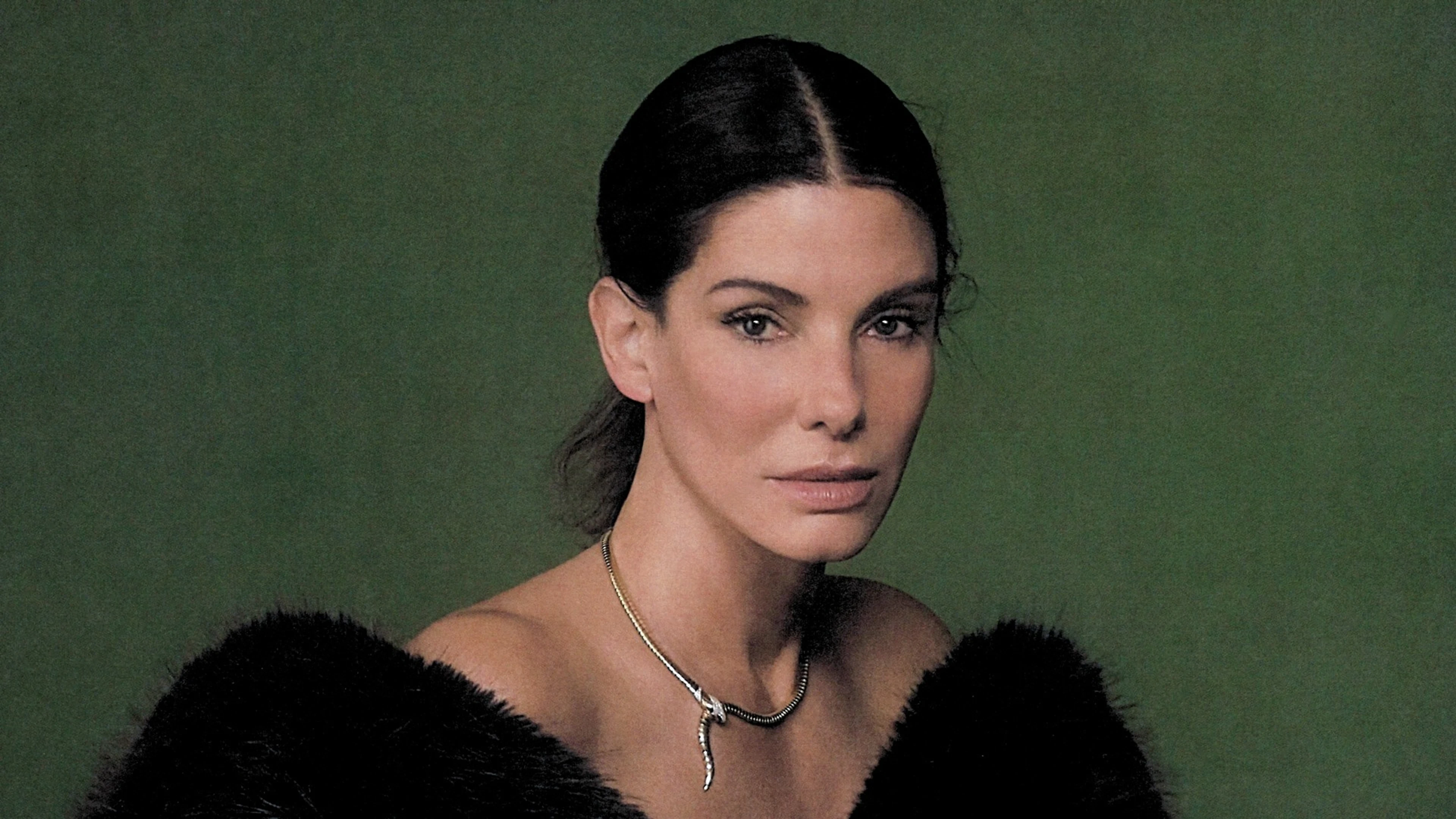 Sandra Bullock faces the camera in a horizontal portrait from her September 2026 cover shoot.