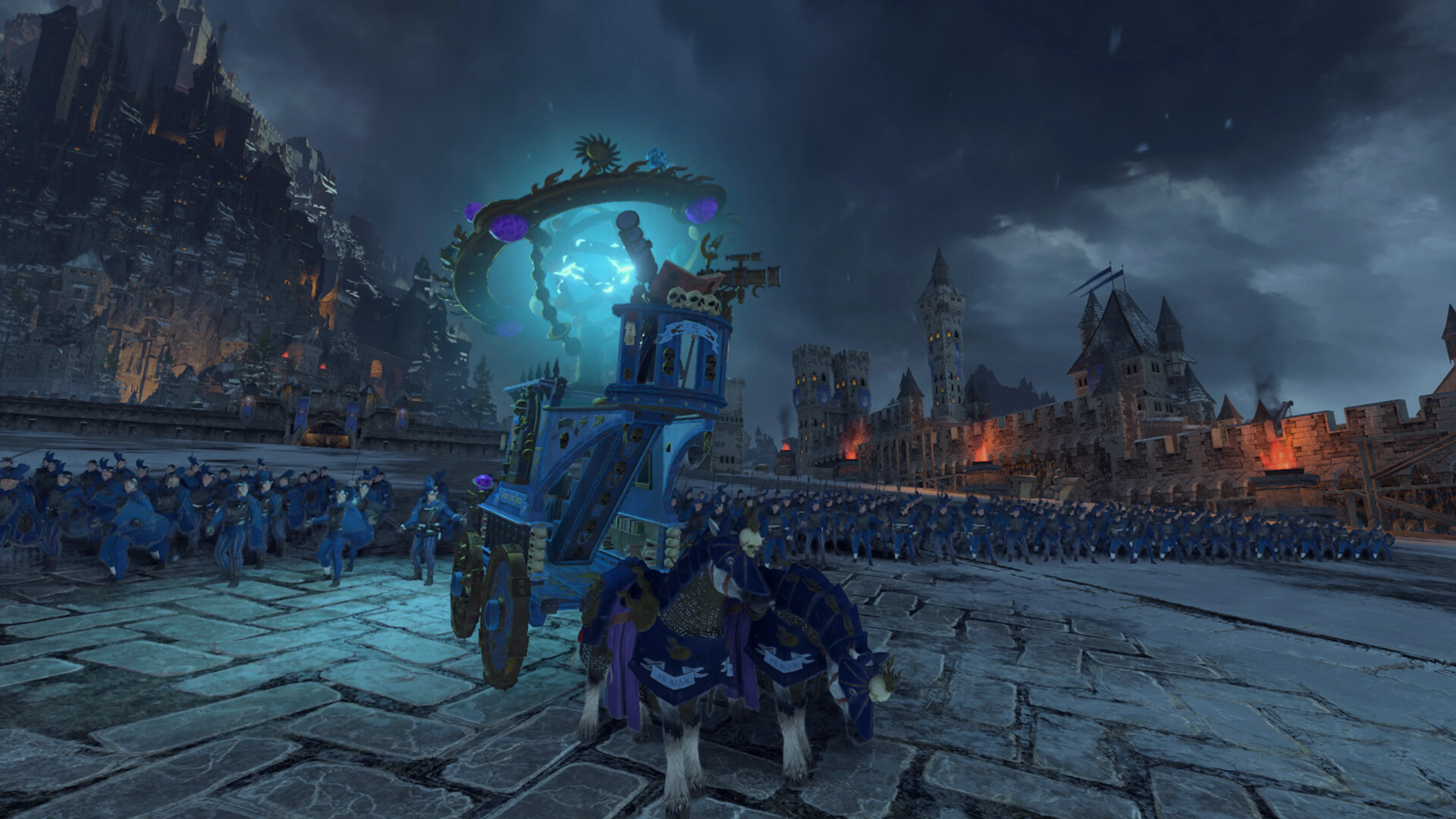 Middenland troops advance beside a blue wagon outside a fortress in Total War: Warhammer III.