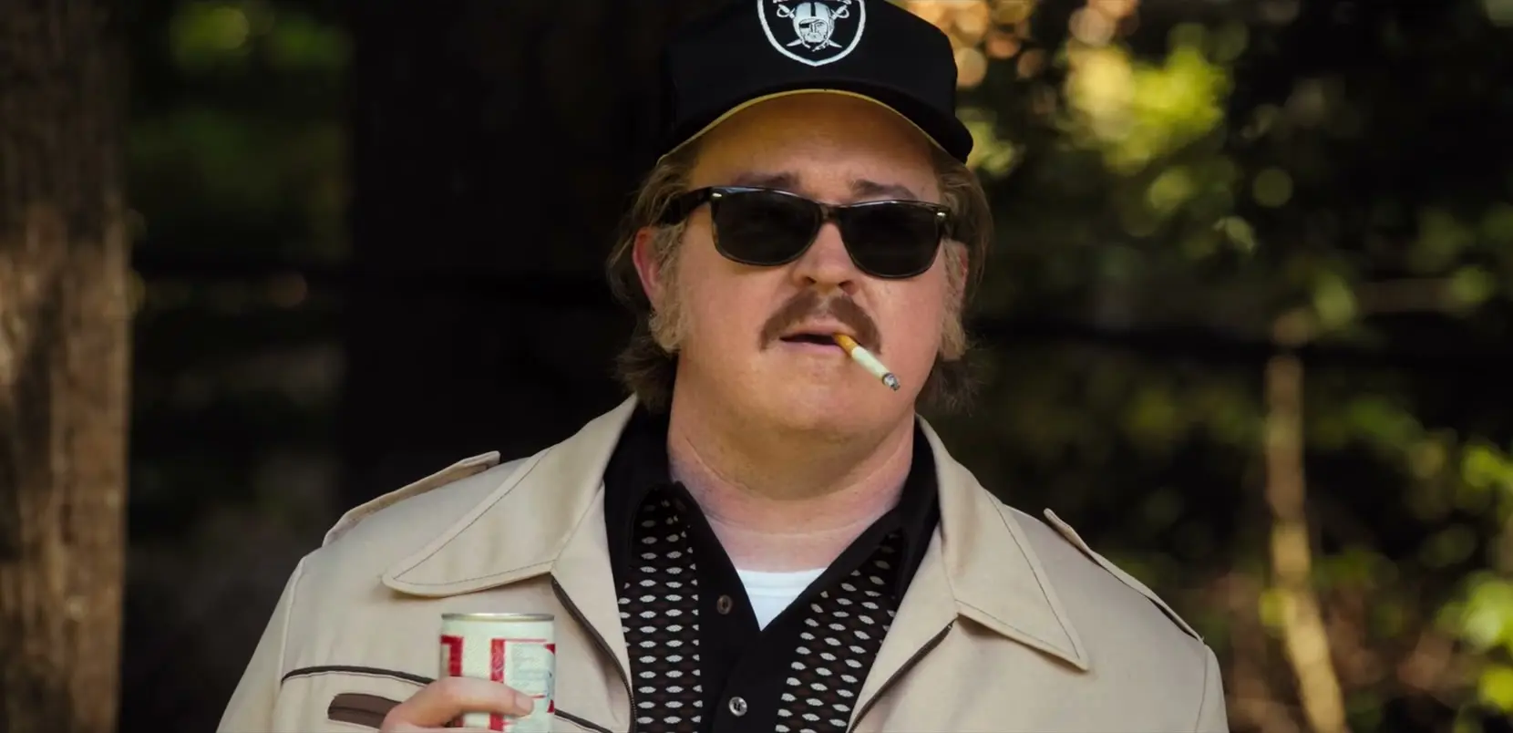 Nicolas Cage as John Madden wears a Raiders cap and sunglasses in the Madden trailer.