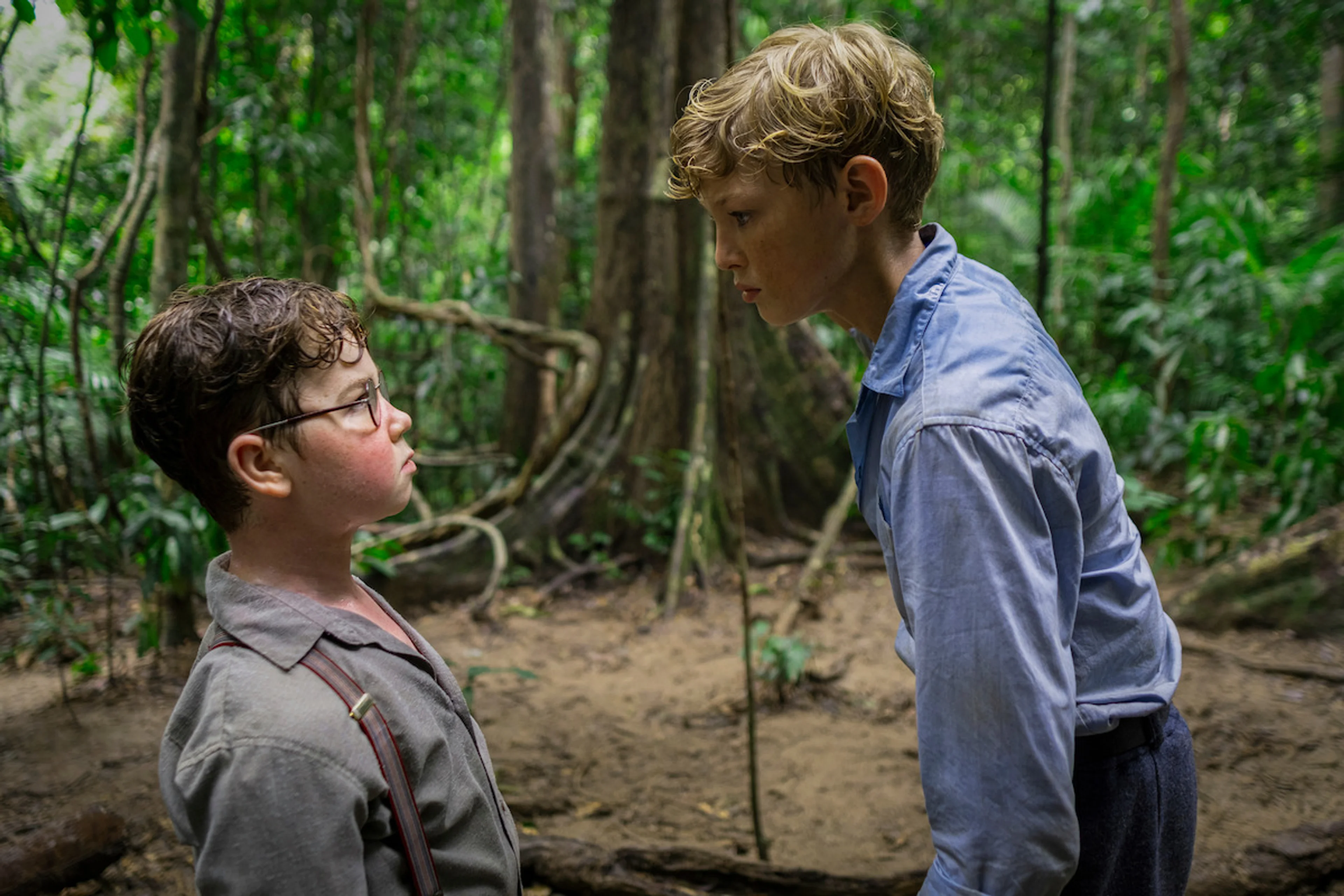 Lox Pratt as Jack stands over David McKenna as Piggy in Lord of the Flies.
