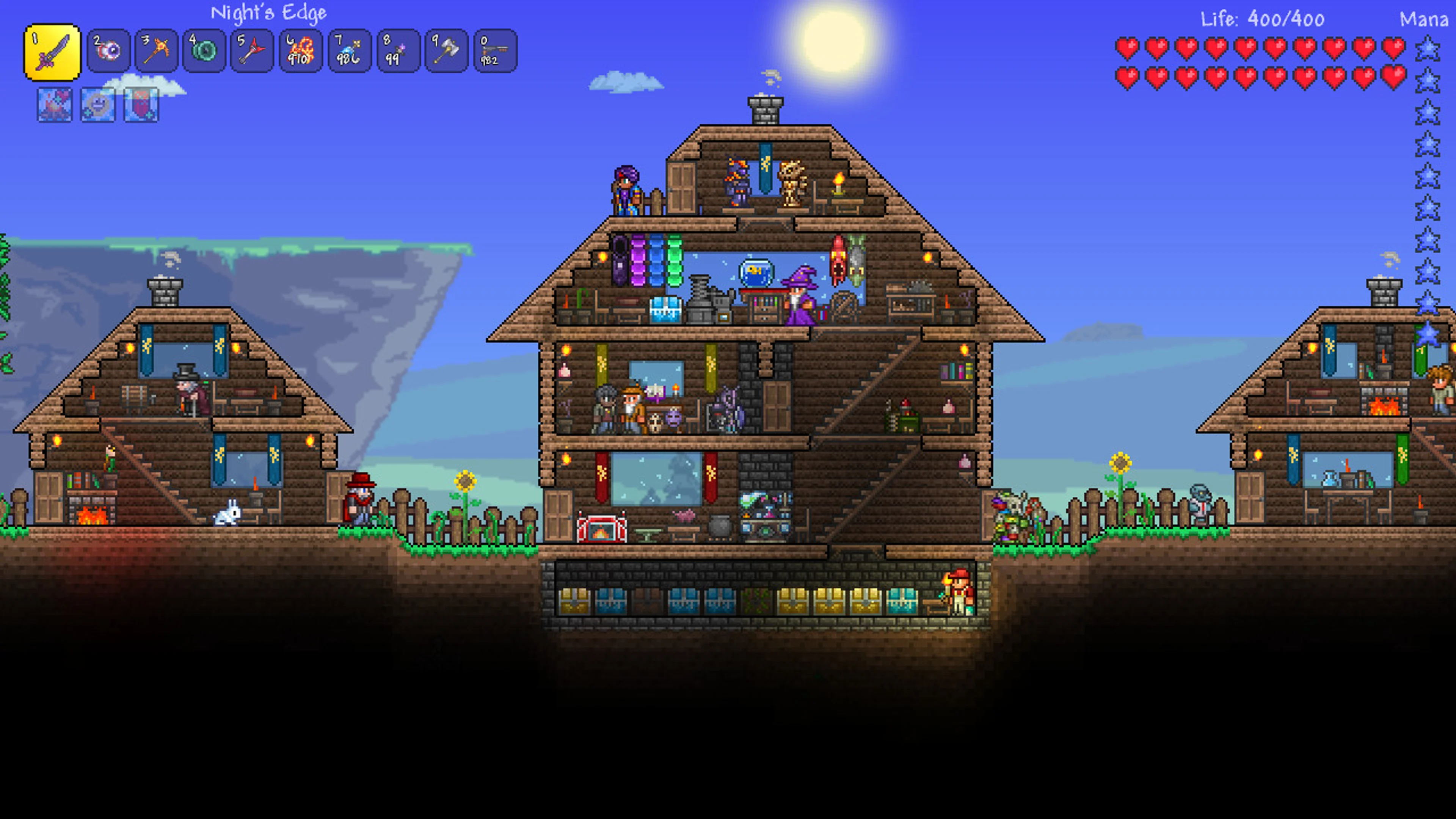 Several player-built homes stand beside each other in Terraria.