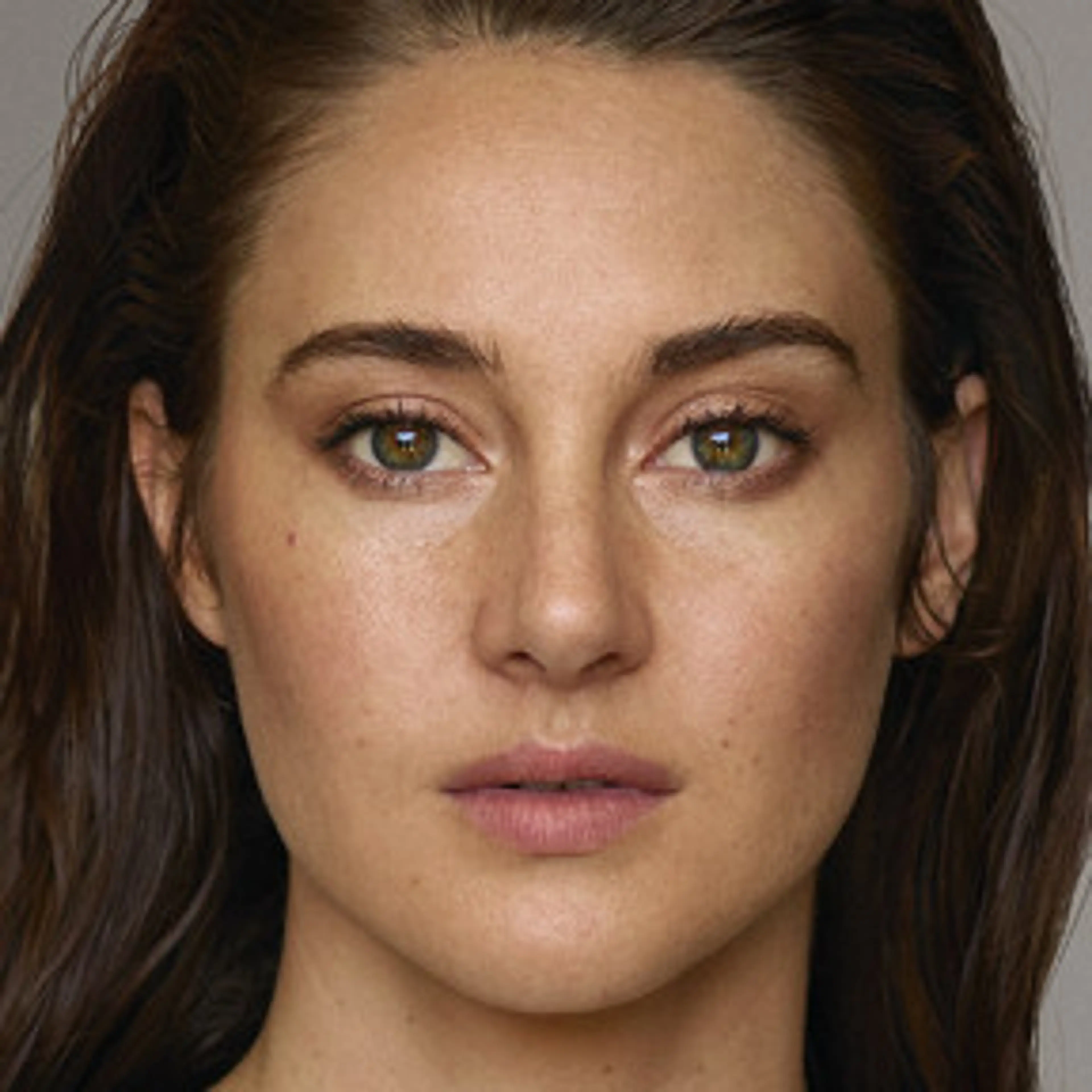 Close-up portrait of Shailene Woodley with brown hair.