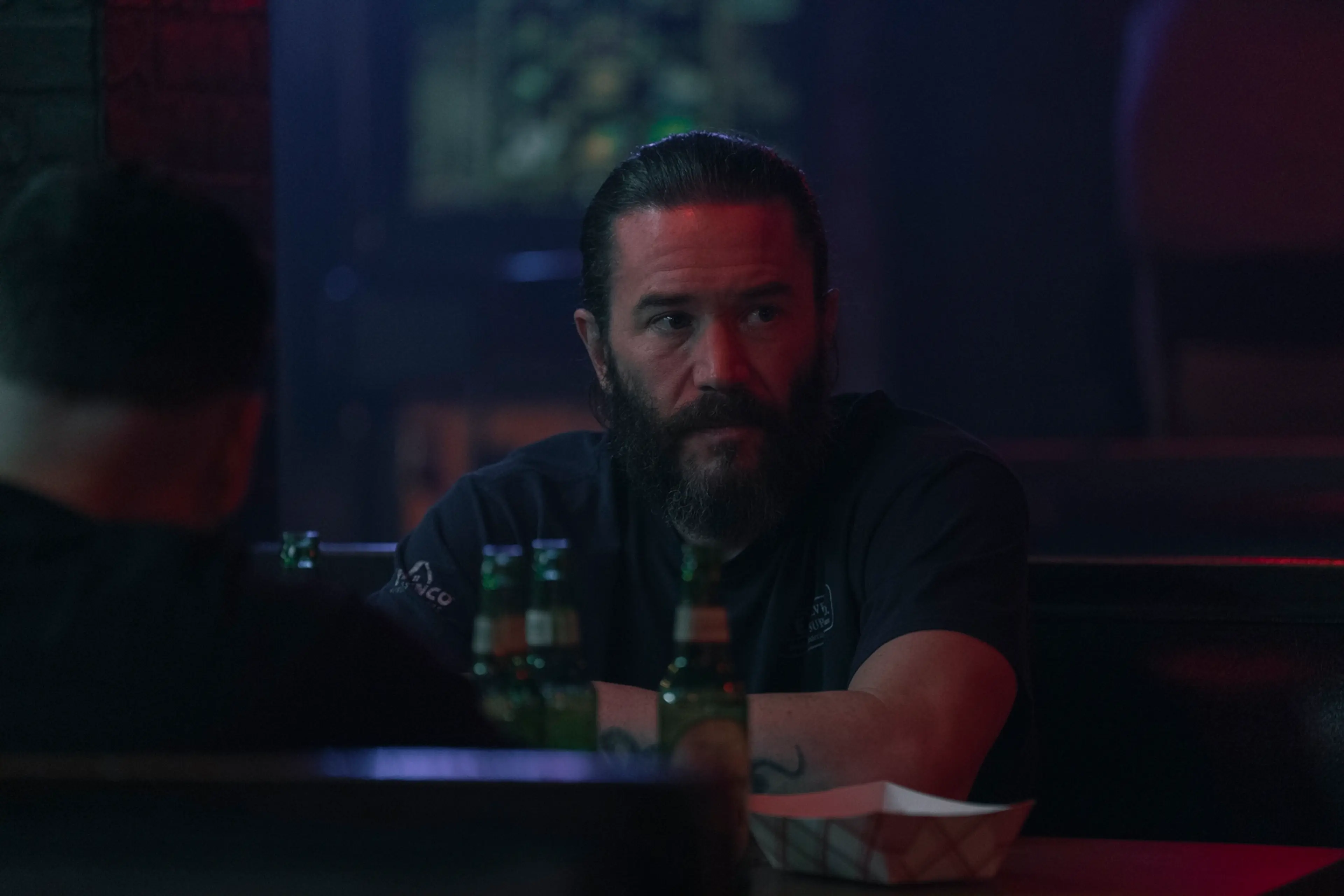 Tom Pelphrey as Robbie Prendergrast sits in a bar in Task.