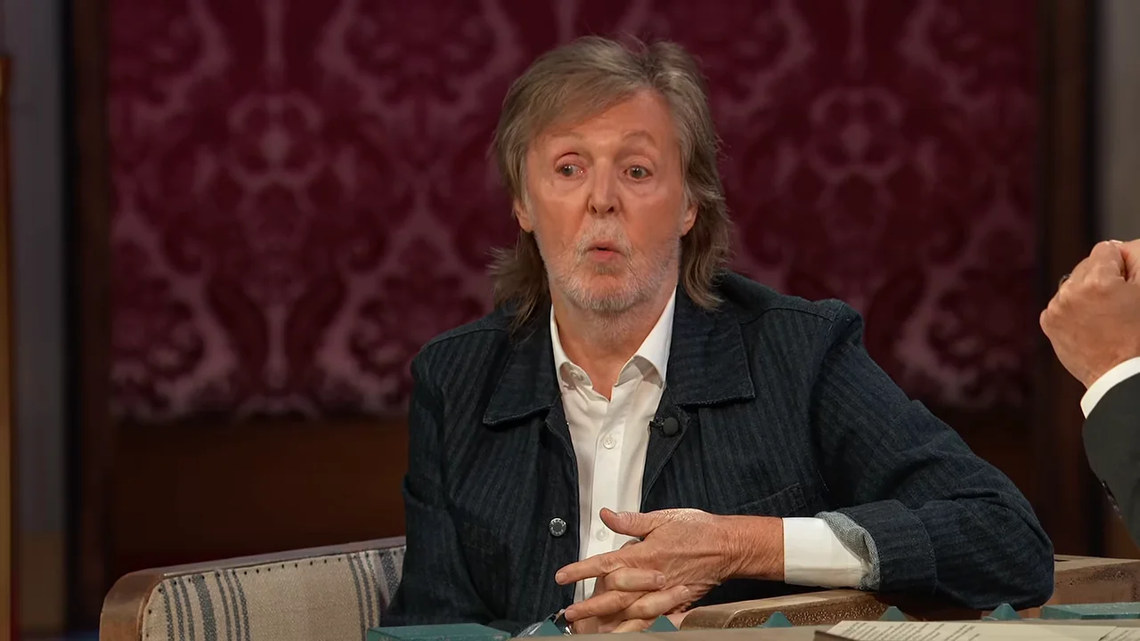 Paul McCartney gestures toward Jimmy Kimmel as they discuss working with Ringo Starr.