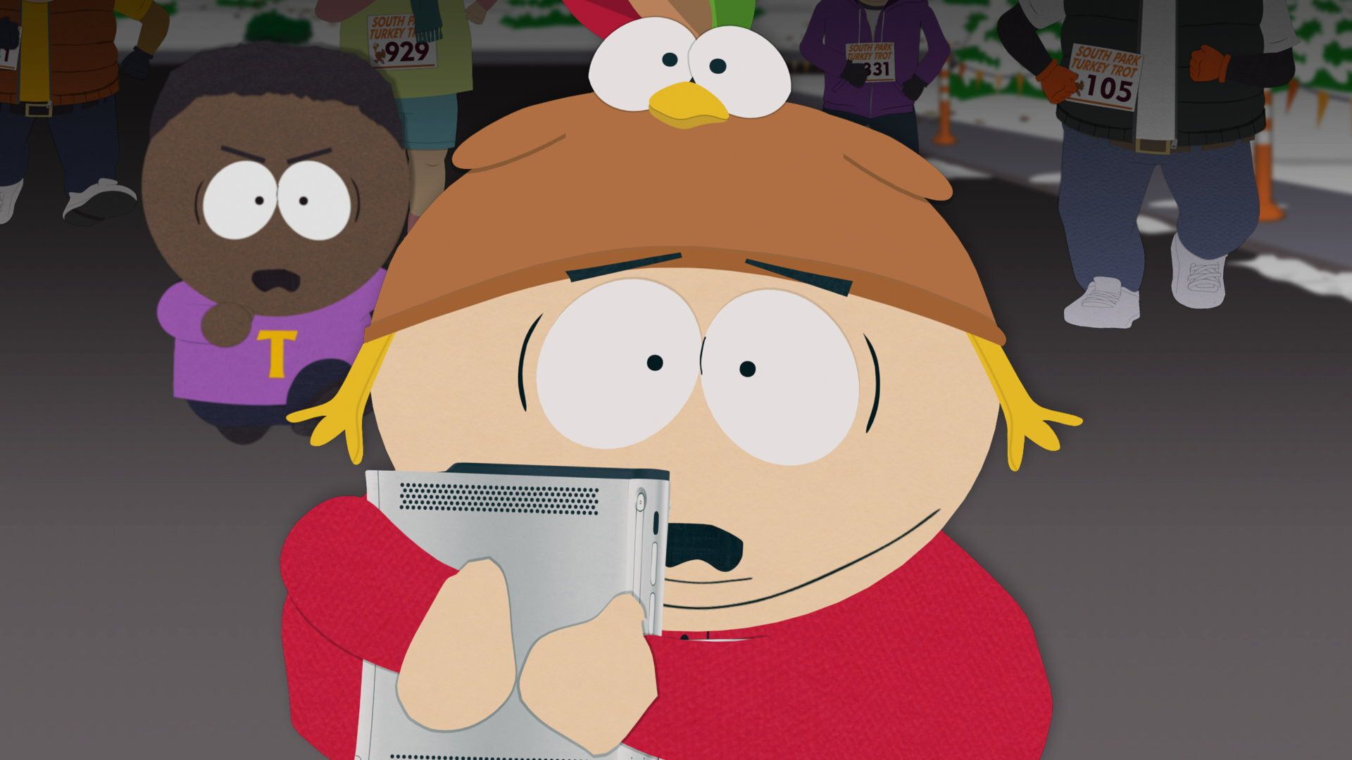 Cartman wears a turkey hat while Tolkien stands behind him in a South Park Season 28 scene.