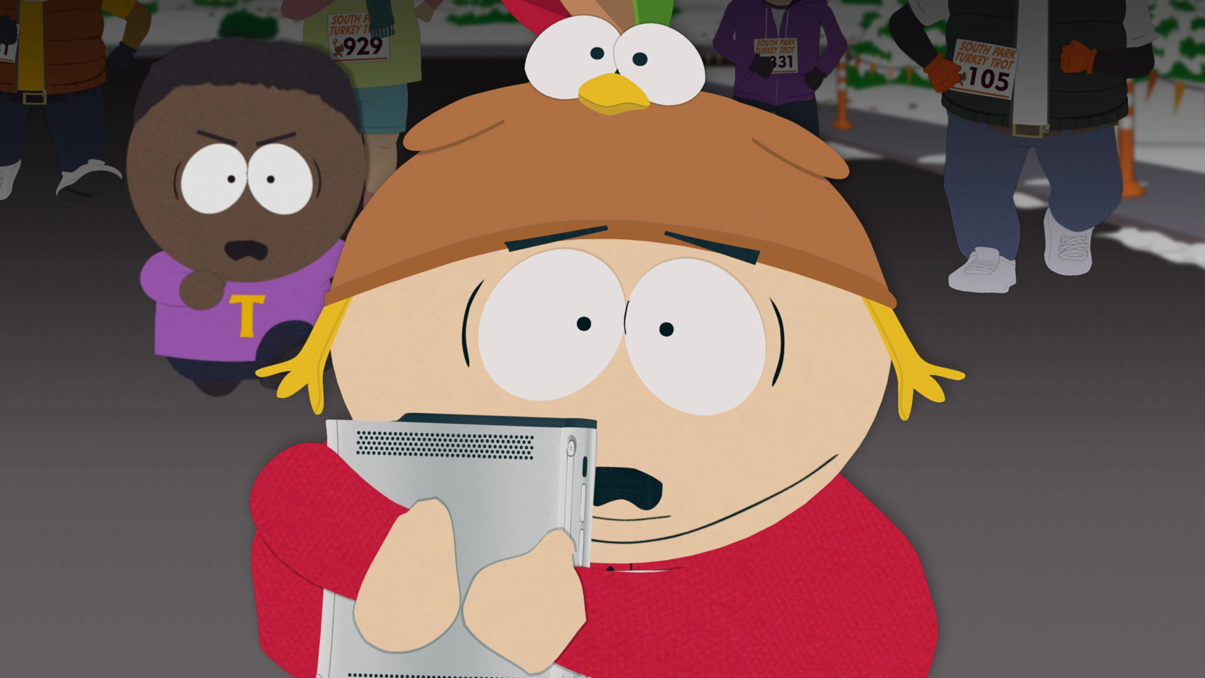 Cartman wears a turkey hat while Tolkien stands behind him in a South Park Season 28 scene.